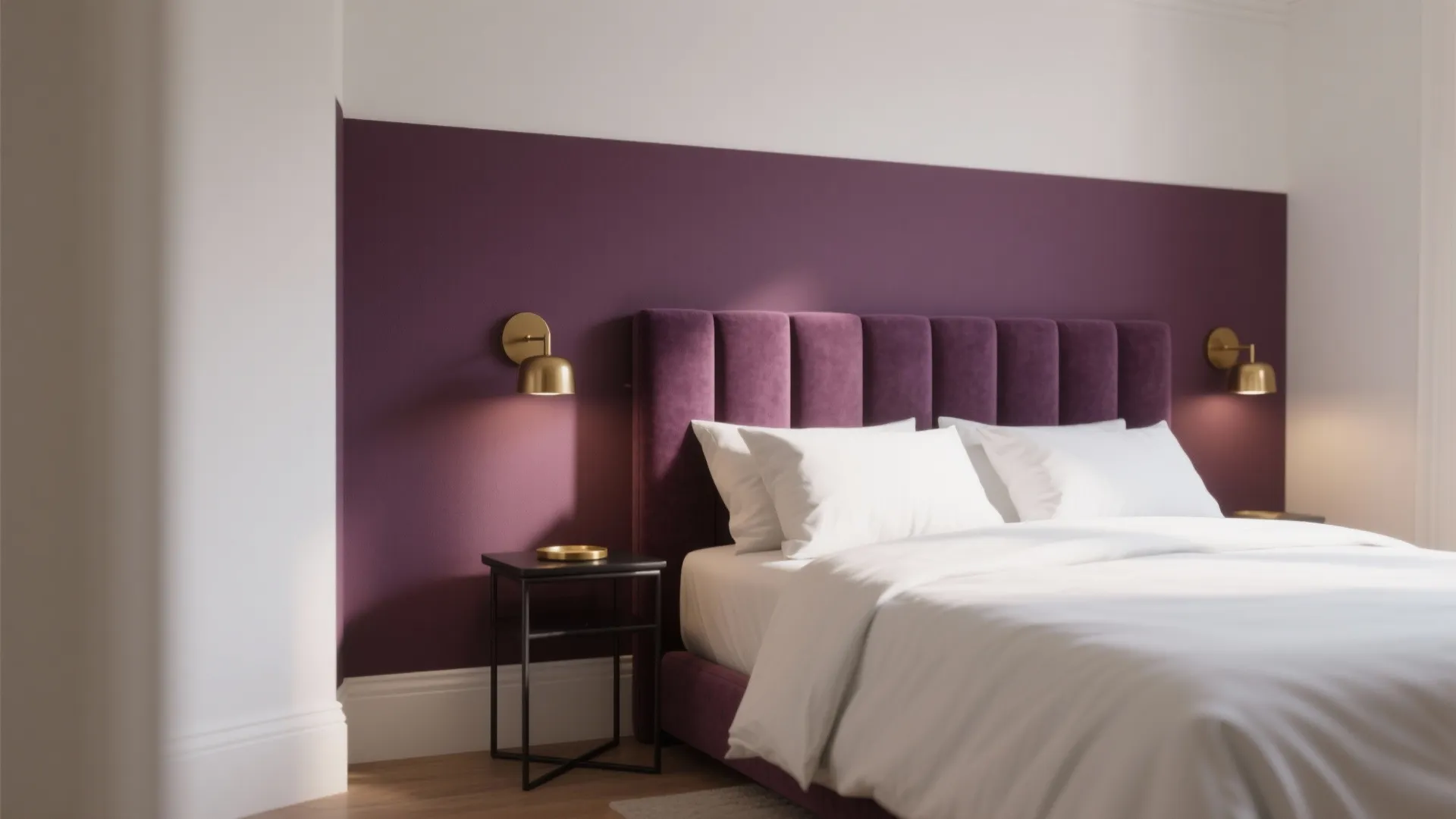 Modern bedroom with purple accent wall plus matching bed headboard and two gold wall lights