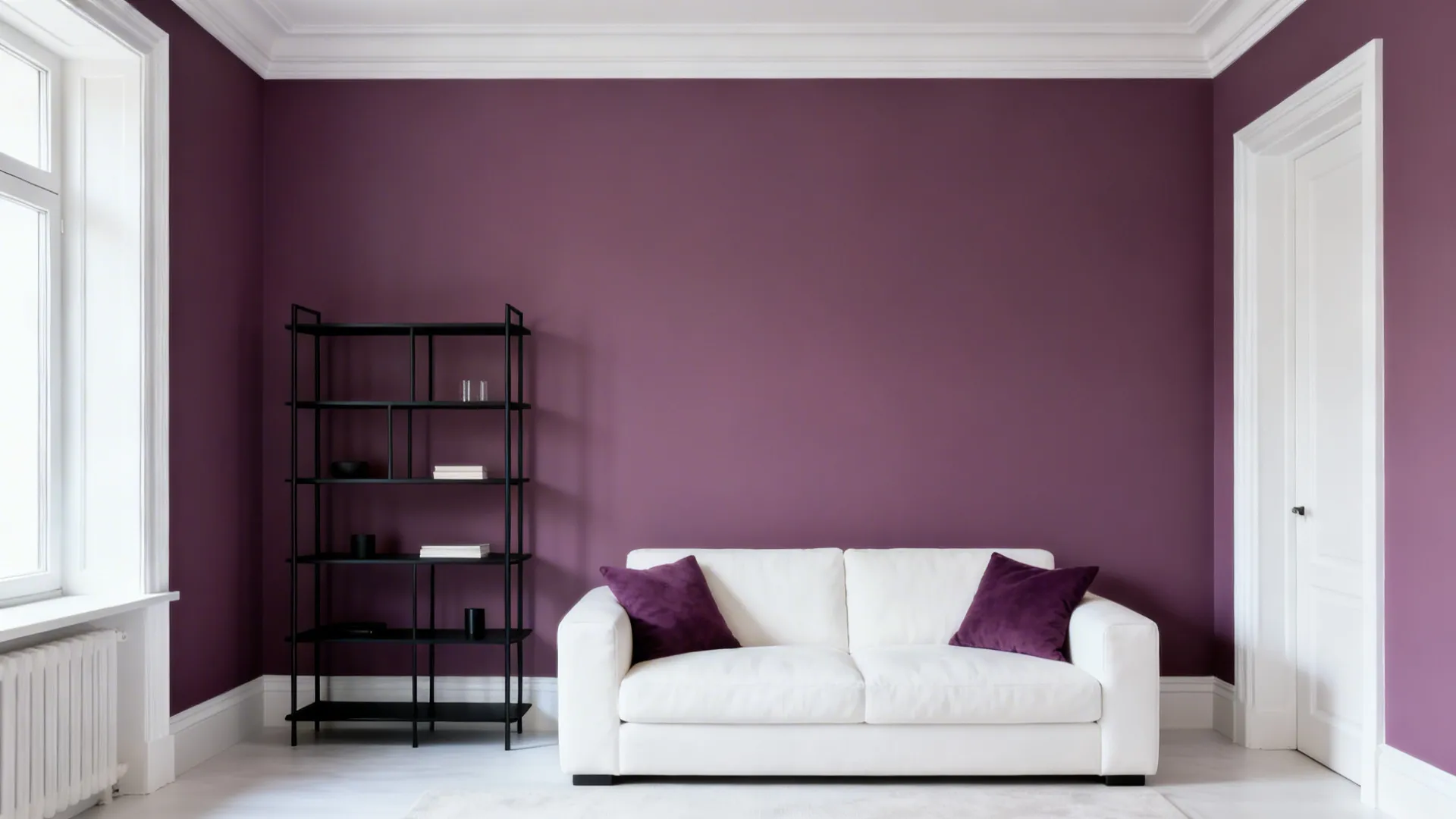 Living room with a muted plum statement wall, black shelving and white trimmed details