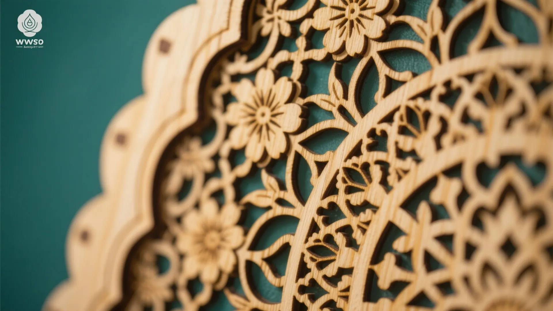 Intricate laser cut wooden wall panel featuring floral patterns against a dark green textured background