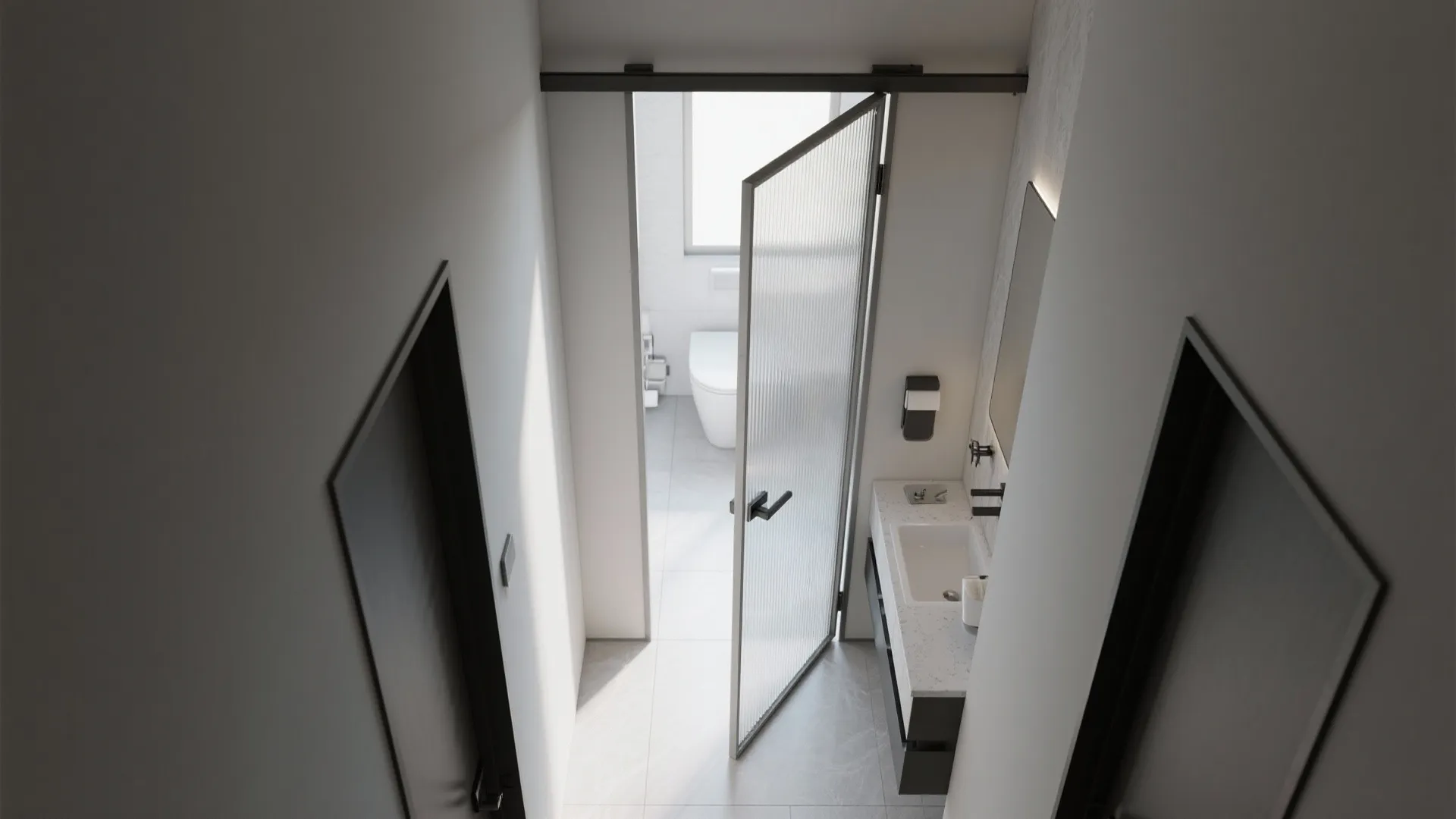 Top view of a bathroom entrance featuring a glass door white toilet sink and grey floor