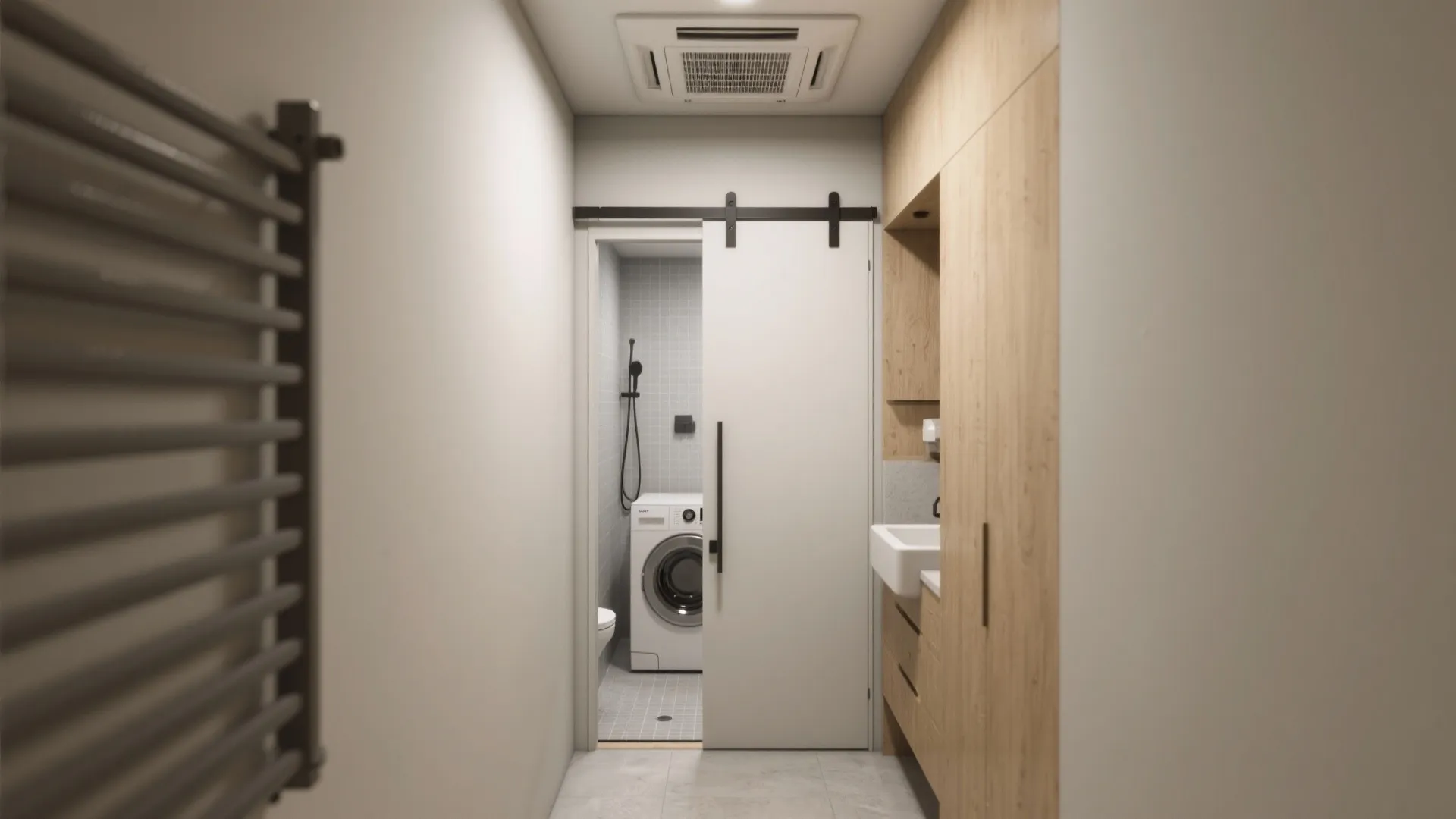 Modern laundry room featuring sliding white door wooden storage cabinets washing machine and white tiled floor