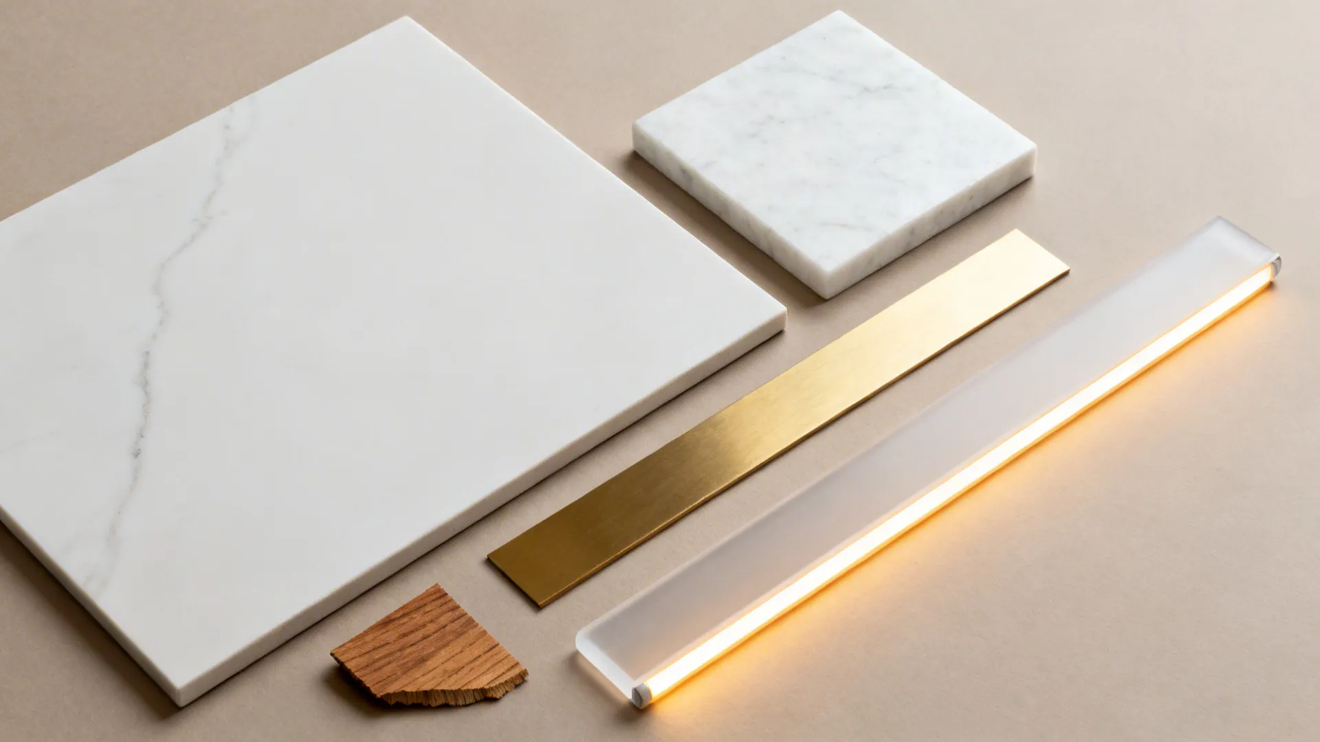 Flat lay of pooja niche materials: honed marble, porcelain slab, brushed brass, oak veneer, frosted acrylic, and warm LED strip.