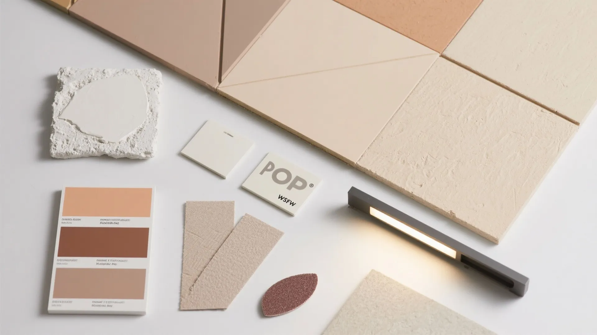 Interior design material board with beige tiles color swatches small light fixture and textured samples