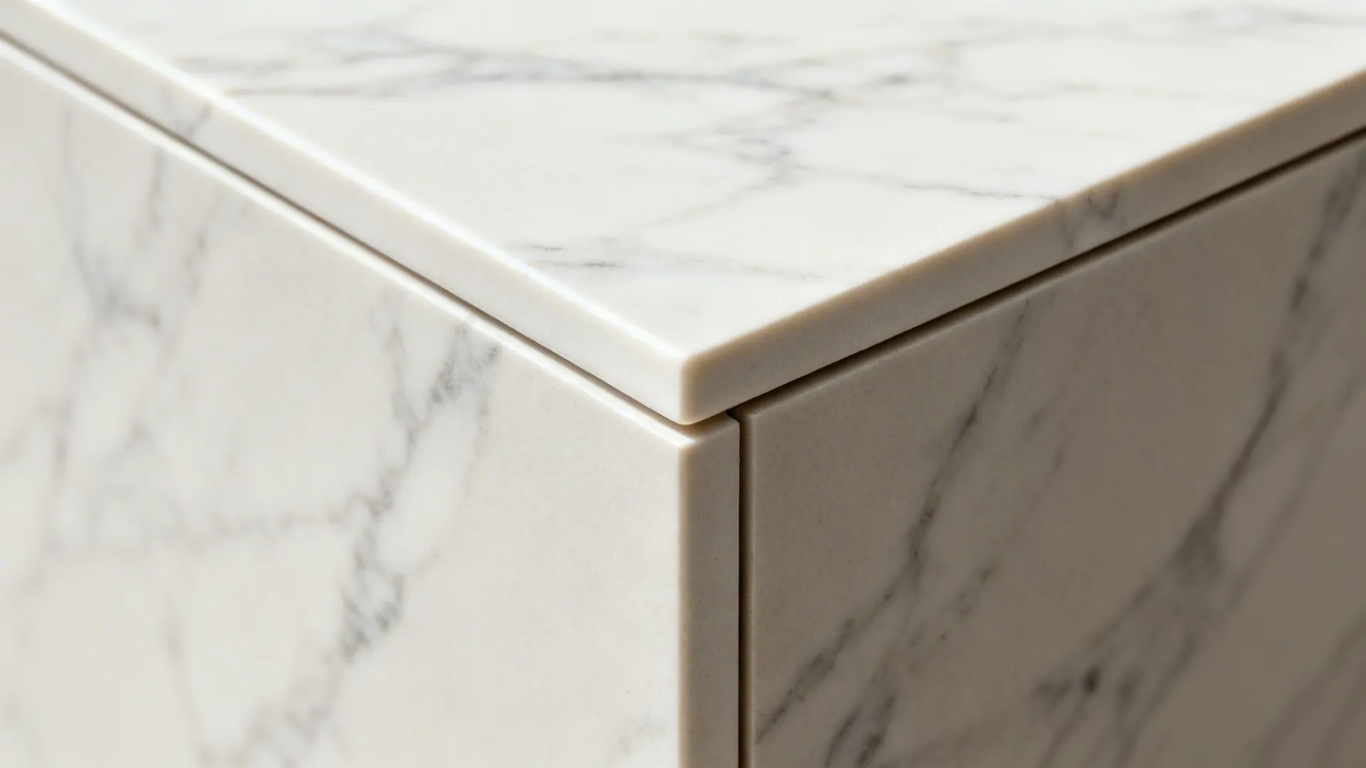 Close up view of a marble countertop corner showing smooth edges and detailed natural stone
