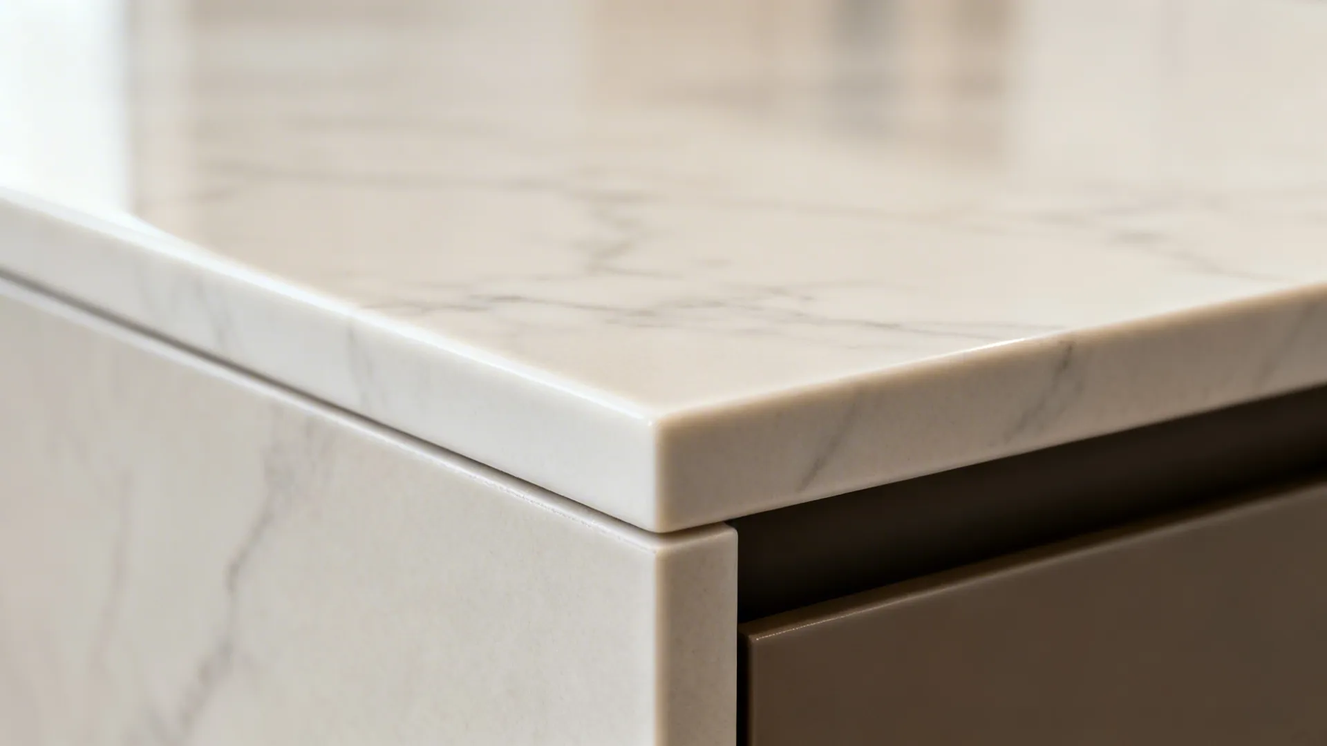 Macro view of a porcelain slab countertop showing a crisp mitered front edge.
