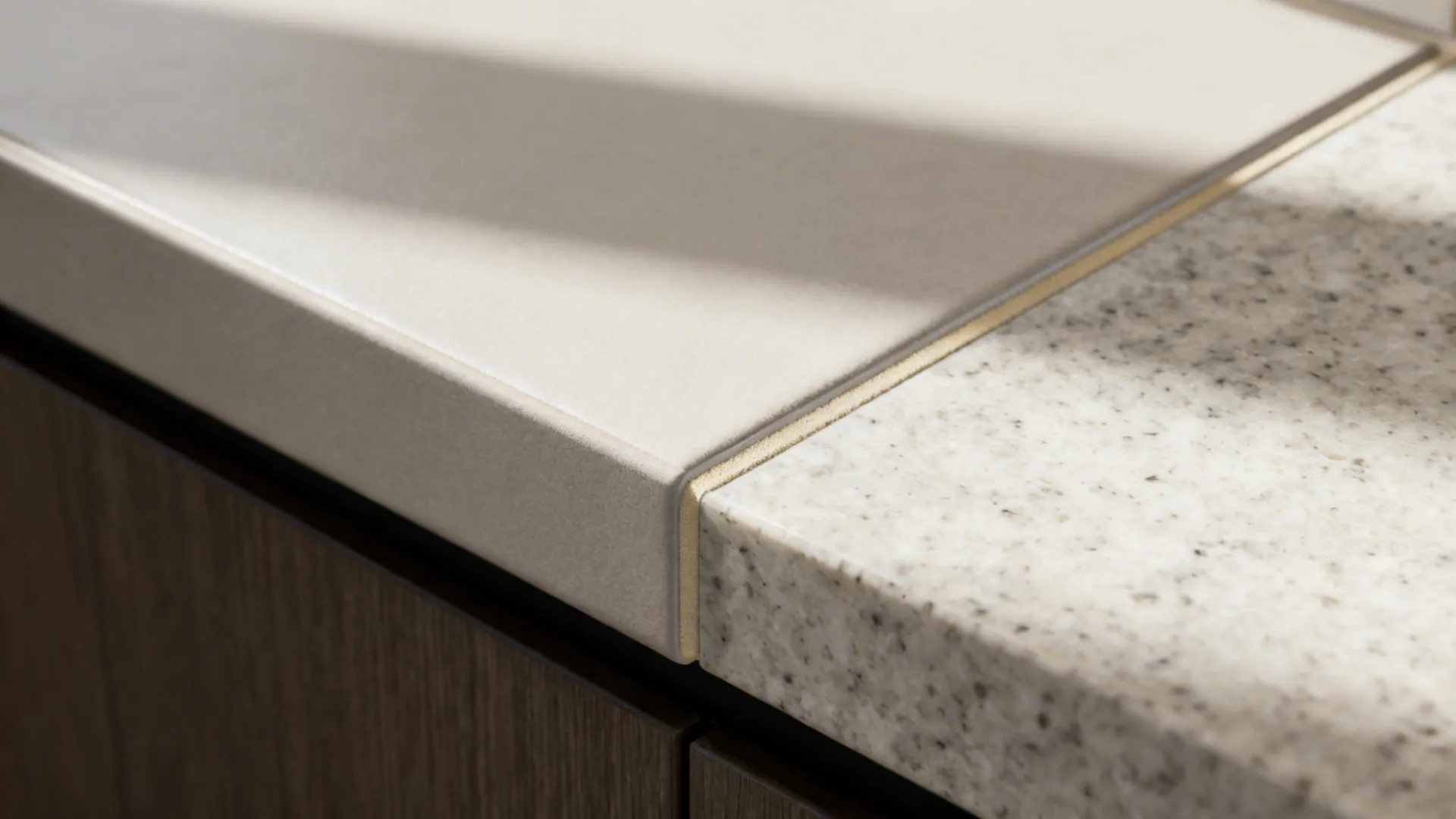 Macro of matte porcelain backsplash edge with neutral grout meeting a quartz countertop.