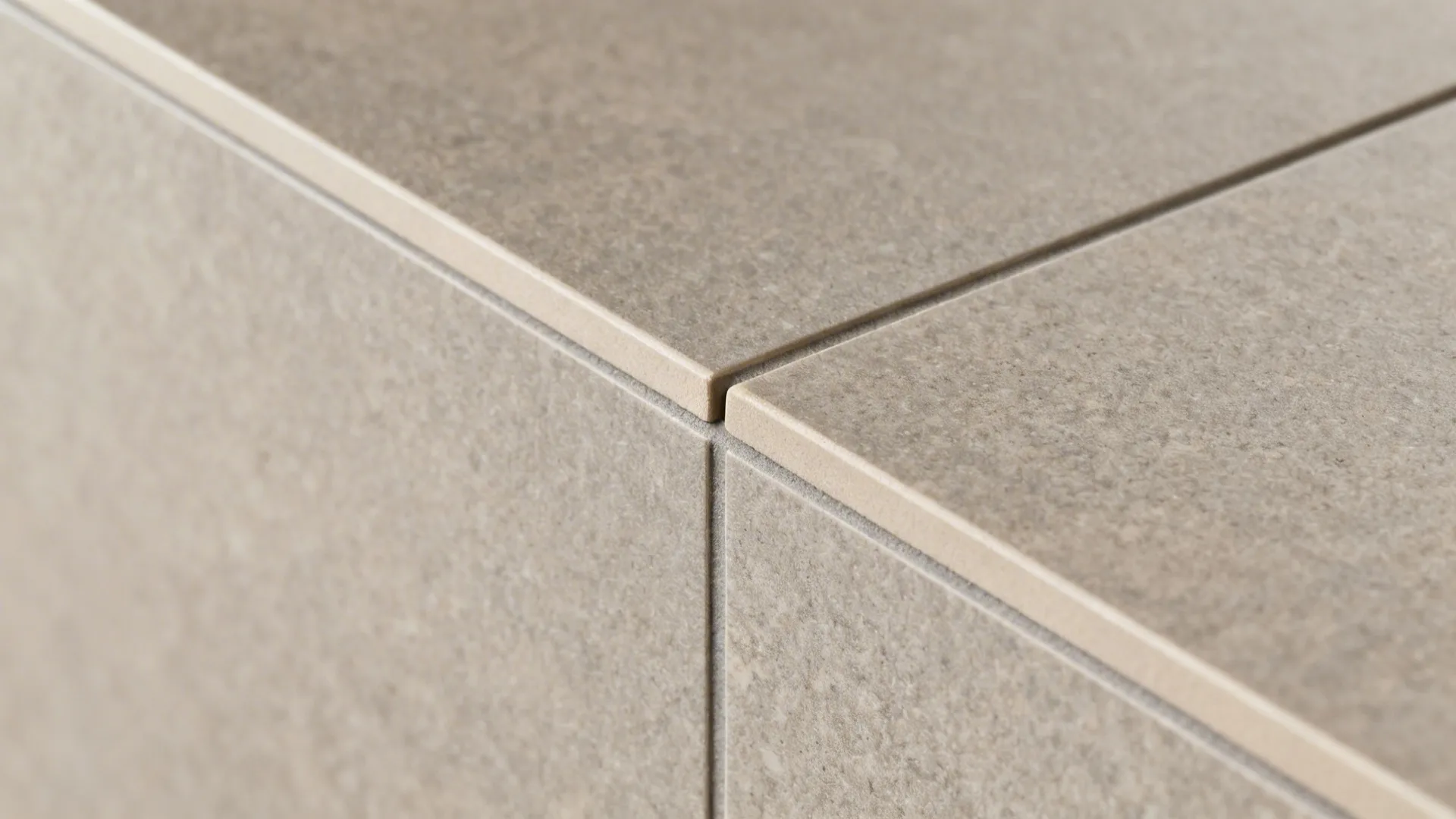 Macro of matte porcelain tile with a precise 2 mm color-matched grout line.