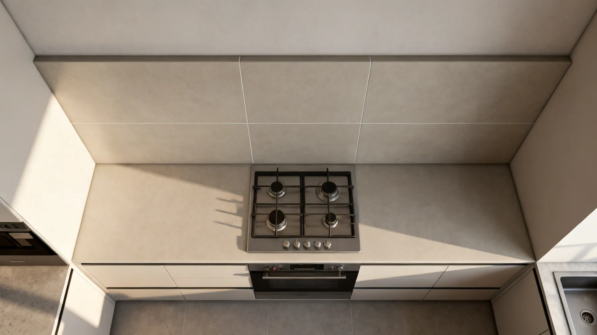 Top-down view of compact kitchen layout showing a large-format porcelain slab backsplash and appliance alignment.
