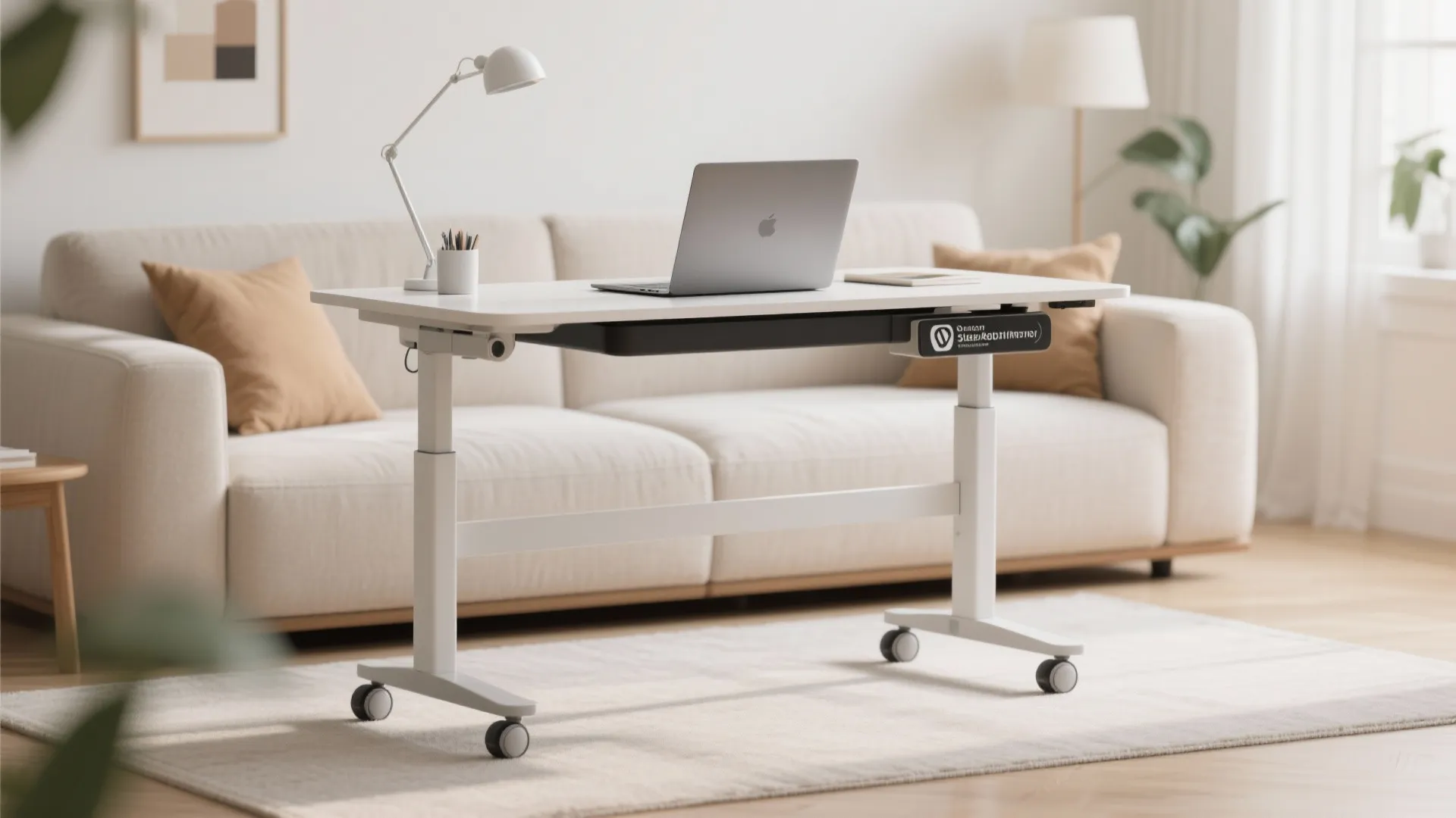 White adjustable standing desk with laptop and lamp on wheels in a bright living room