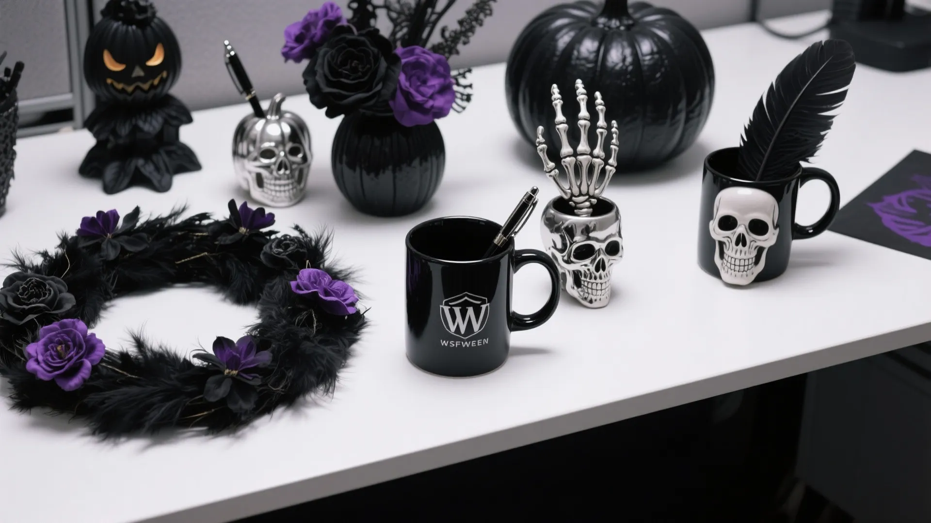White office desk with black pumpkin skull mugs purple flowers and Halloween themed desk accessories