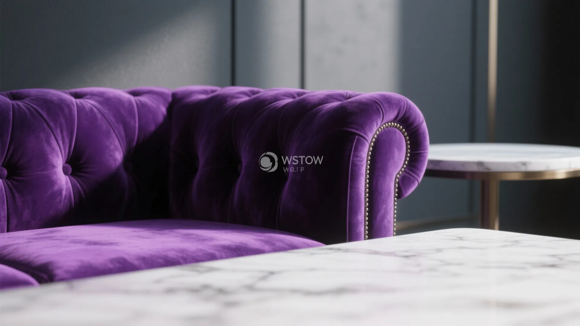 Close up of a purple velvet sofa with marble side table and soft indoor lighting