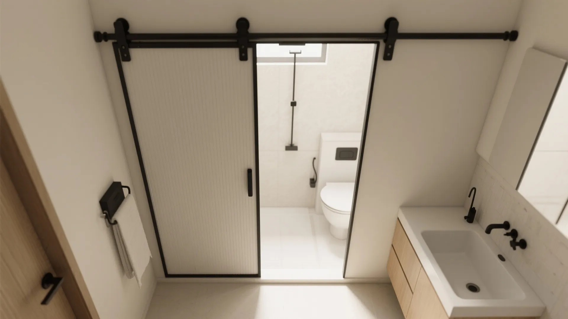 White sliding door with black track showing bathroom with a toilet and a white sink vanity