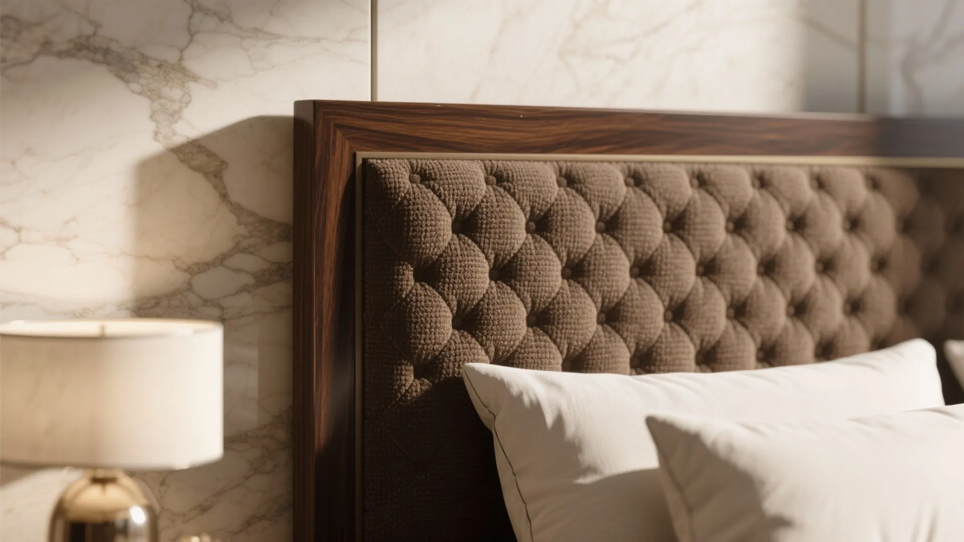 Macro of matte walnut, boucle upholstery, and honed limestone textures in warm light.