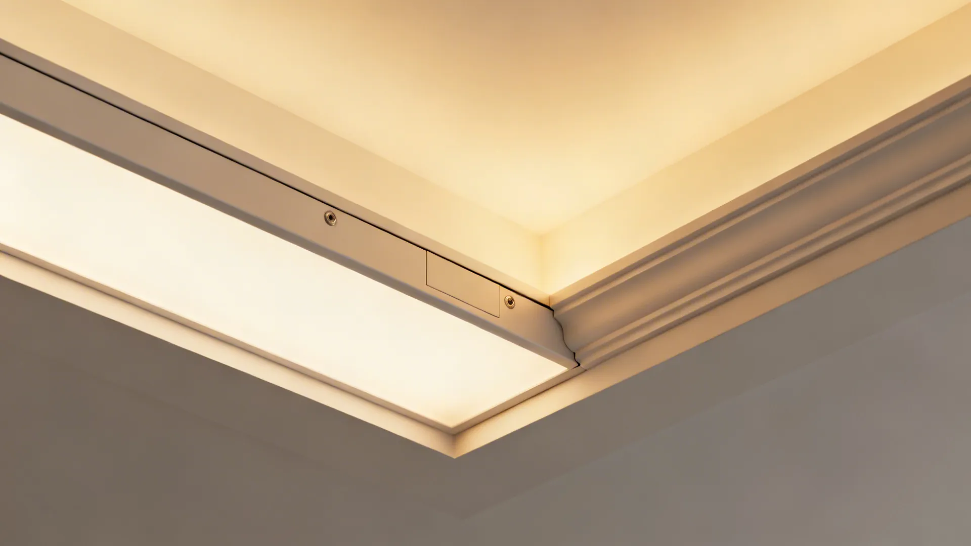 Macro of a floating ceiling band with a neat access panel seam and integrated LED diffuser.