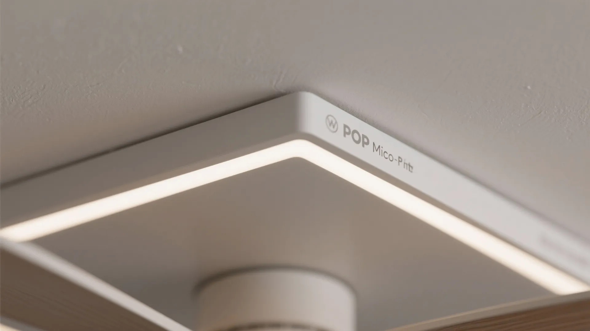 Macro detail of a POP raft edge with slim downlight and low-profile fan base.