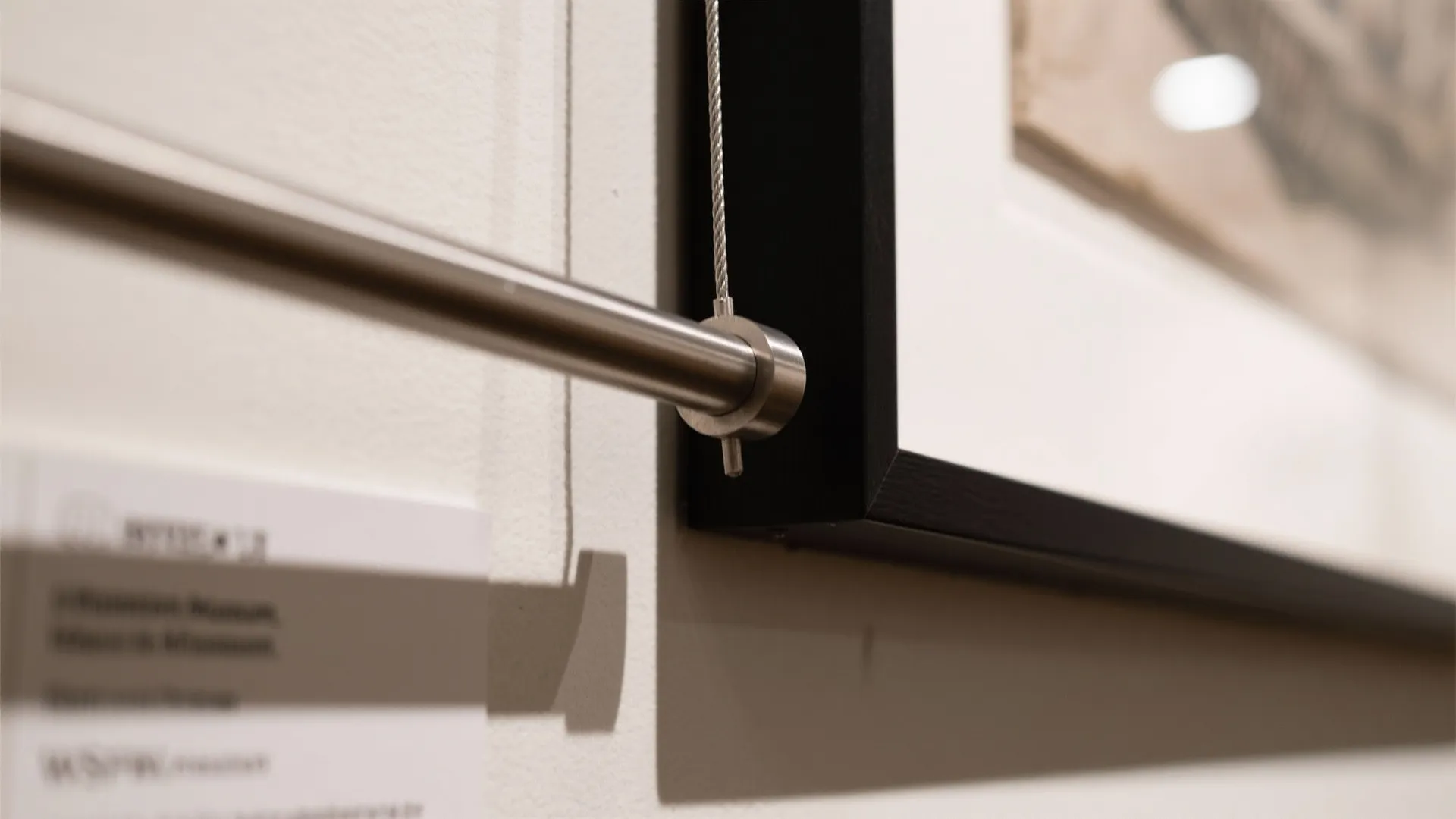 2) Two-Story Gallery Wall with a Rail (Art That Grows with You)