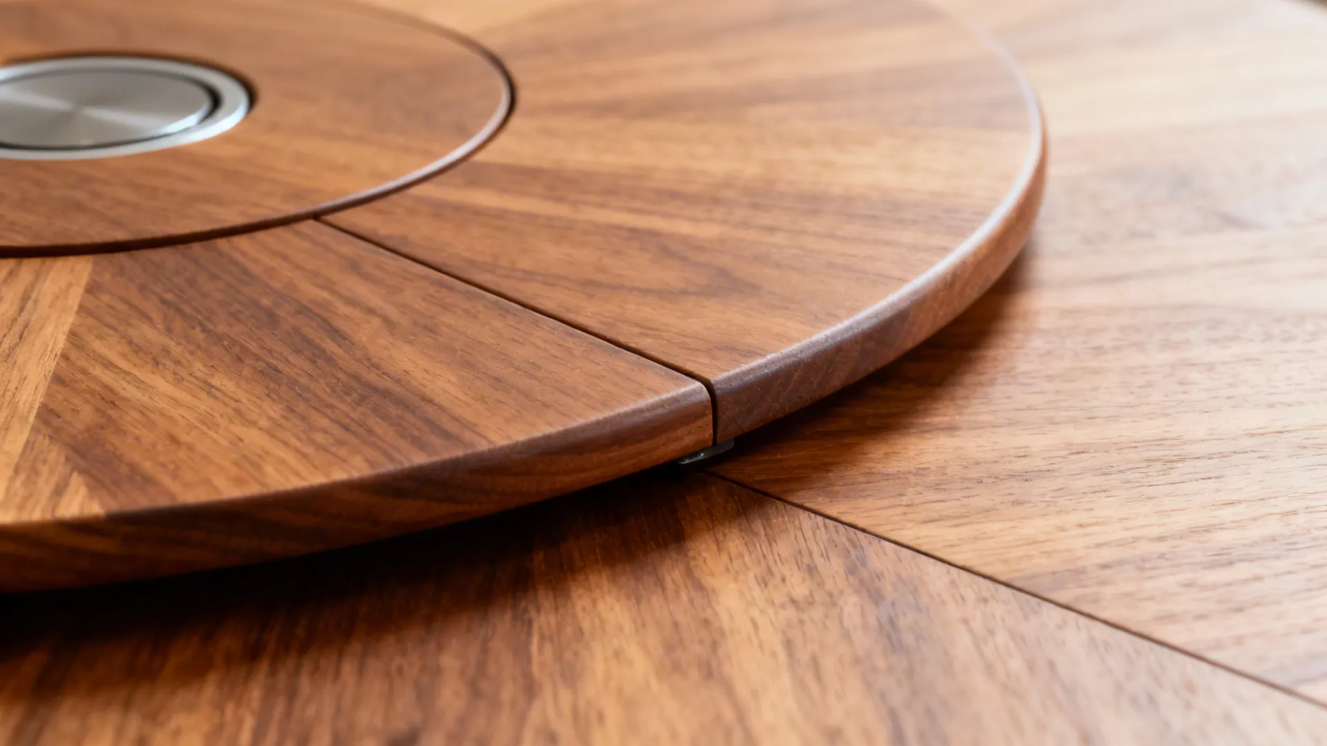 Close up of wooden dining table surface showing natural grain and revolving circular wood center