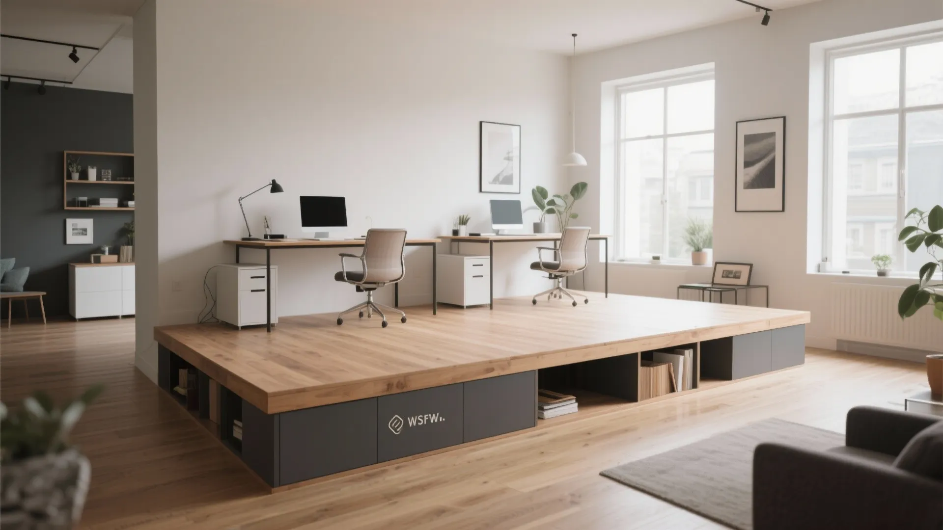 Modern home office with two desks on a raised wooden platform and white cabinet storage