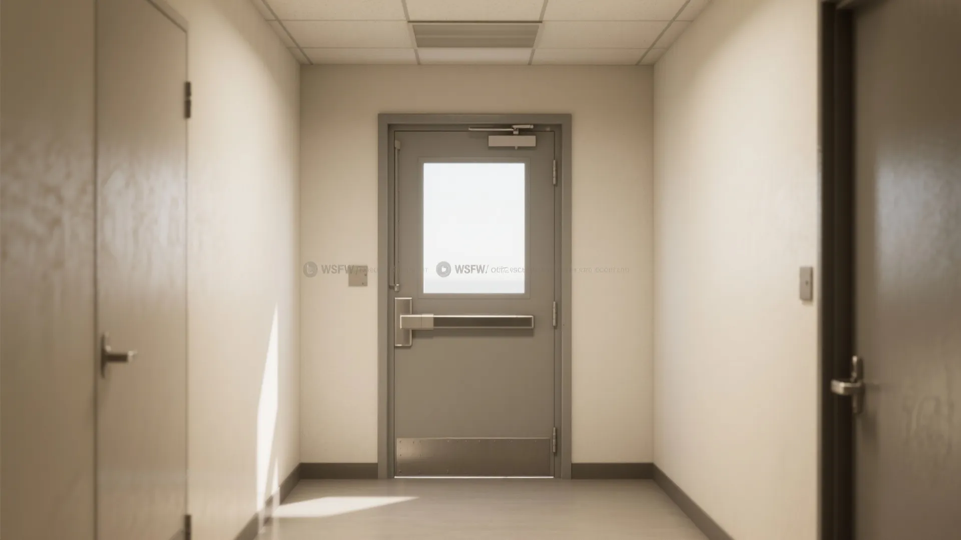 Clean hallway interior design with a grey metal door and small window at the end