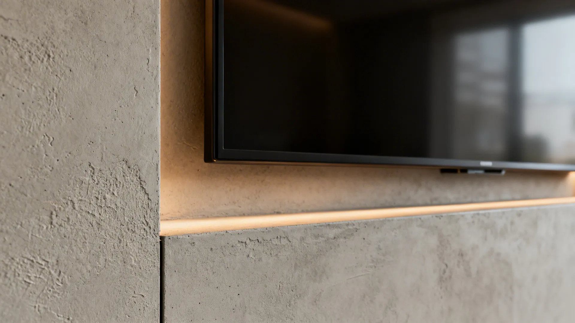 Macro of microcement TV recess showing a precise shadow gap and warm LED wash.