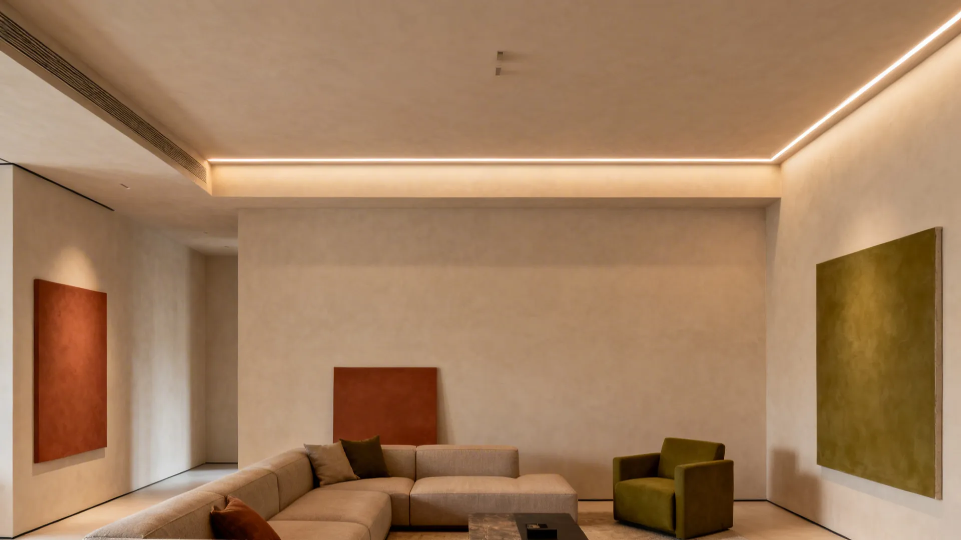 Minimalist plaster ceiling with knife-edge recessed linear lights in a clean living room.