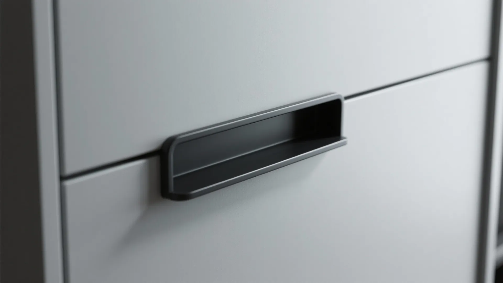 Recessed matte black pull flush with cabinet face for a streamlined look