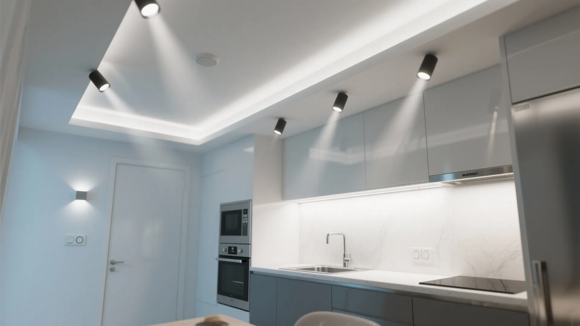 Small kitchen ceiling with recessed spotlights angled toward countertops