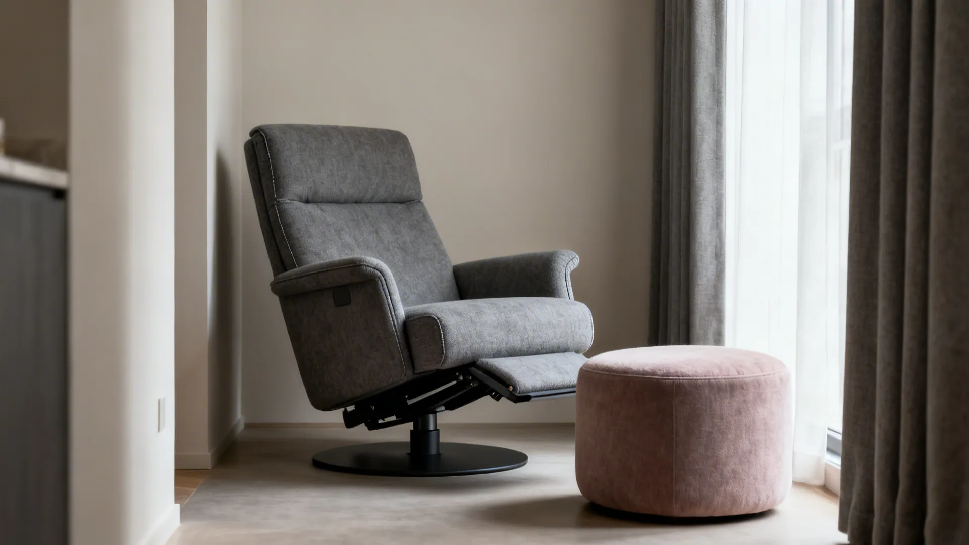 Compact reclining accent chair with a round ottoman in a small living room.