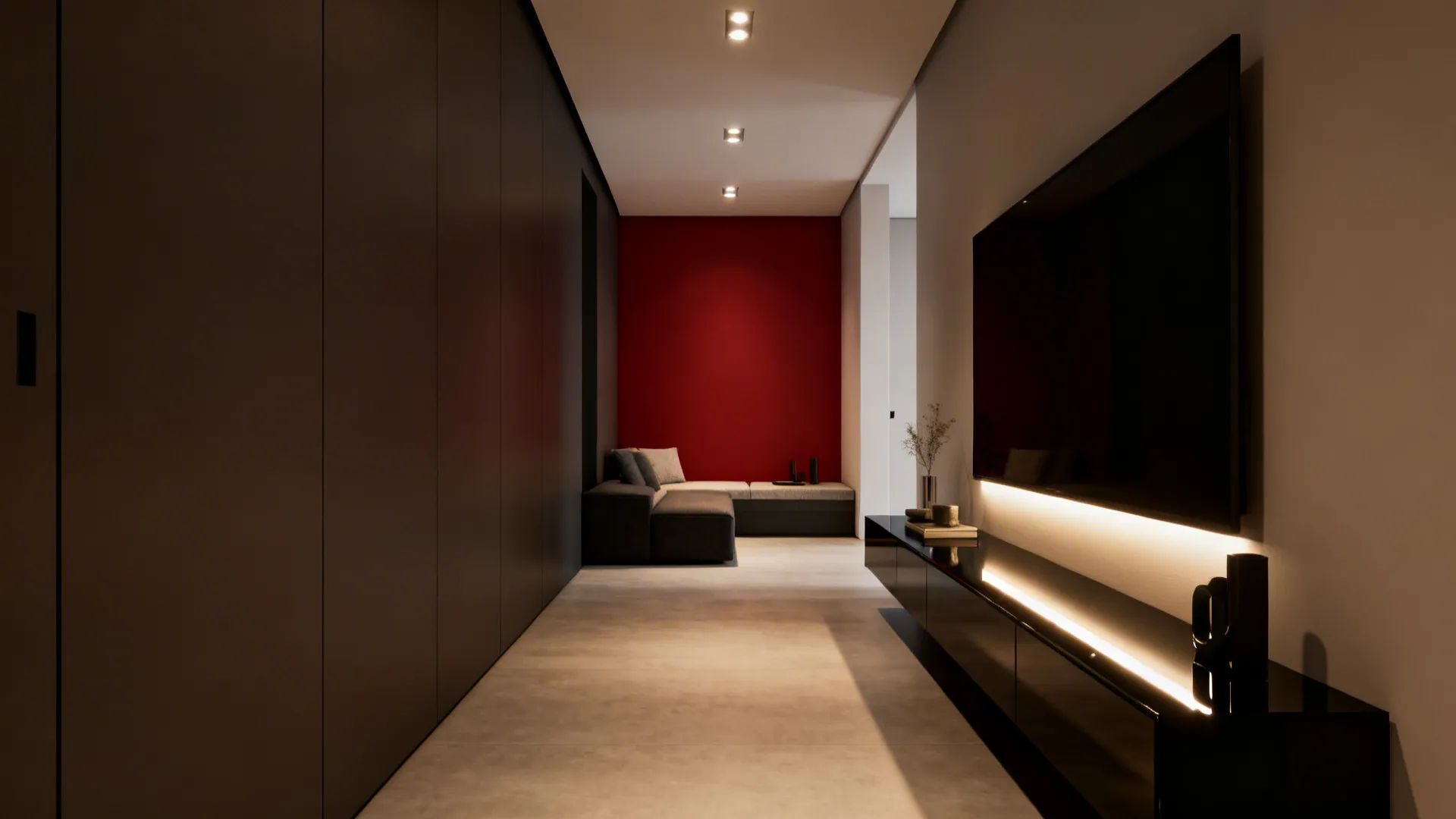 Narrow living room with a single red feature wall and glossy black media console with layered lighting.