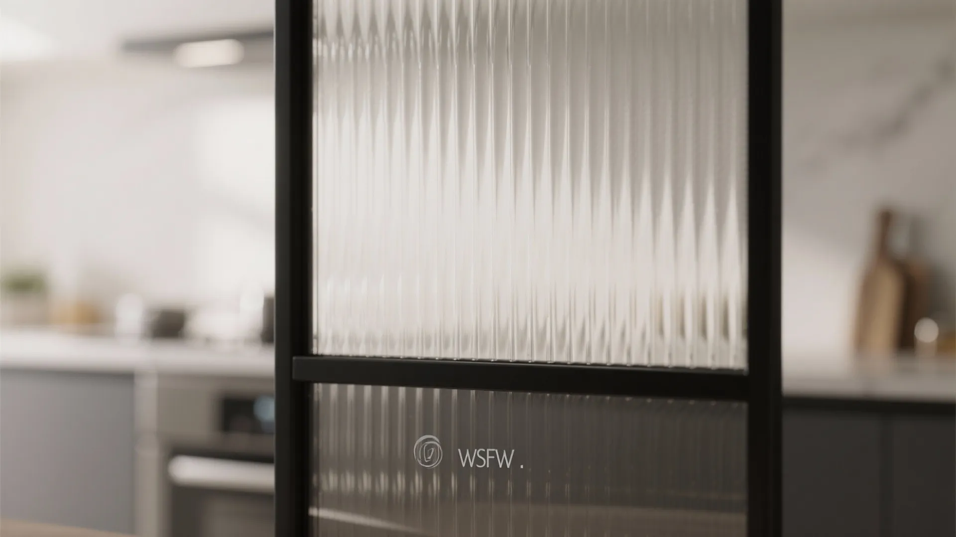 Close up of a textured glass door panel with a black frame in a modern kitchen