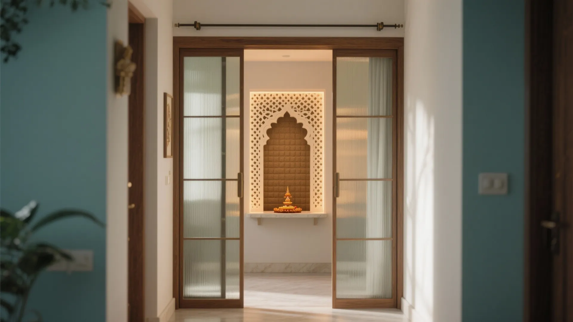 Glass sliding doors opening to a small prayer room with an arched white wall panel
