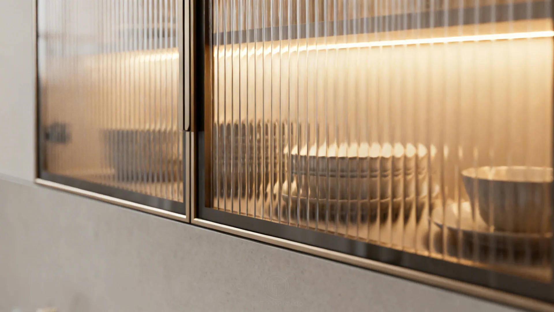 Close-up of reeded glass door with warm LED lighting and matte cabinet surface.