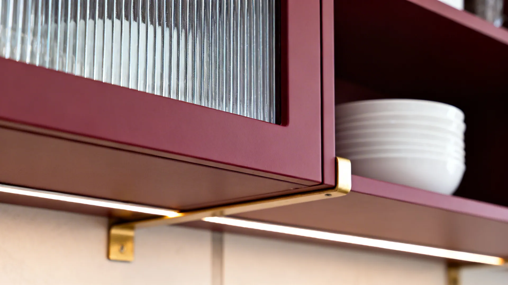 Open shelf accents and glass fronts to relieve depth