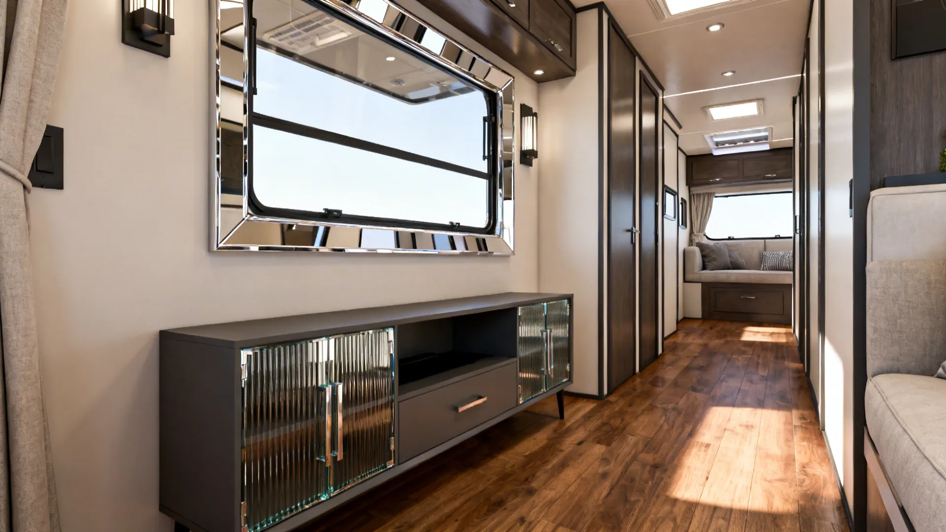 Slim console with fluted glass and a framed mirror reflecting window light in a narrow living room.