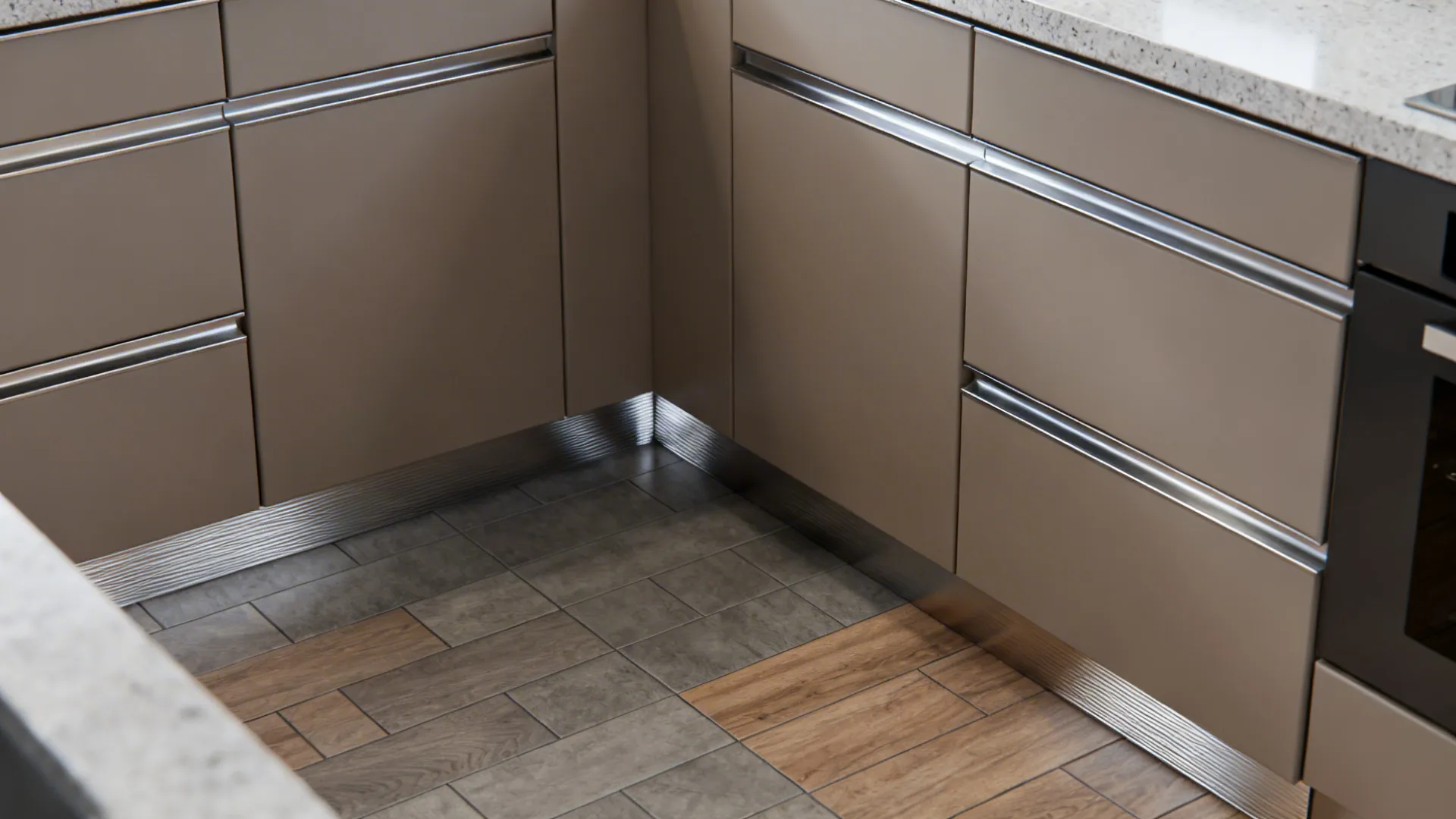 Top-down view showing elevated toe-kicks and water-resistant materials in a small kitchen.