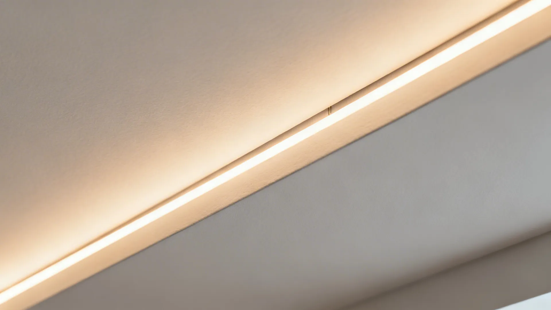 Close up of a modern light fixture with a long led strip built into the ceiling