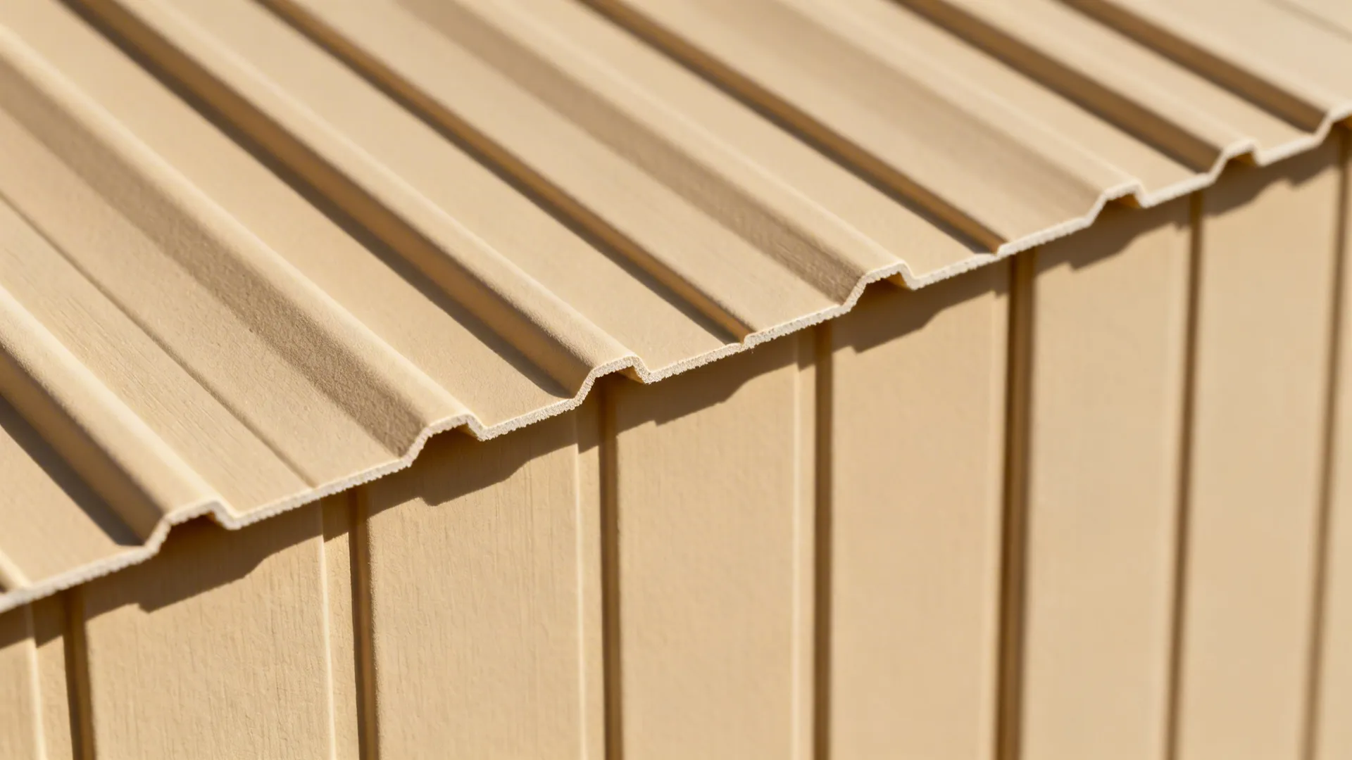 Macro detail of sand-beige ribbed PVC panel showing precise grooves and soft texture.