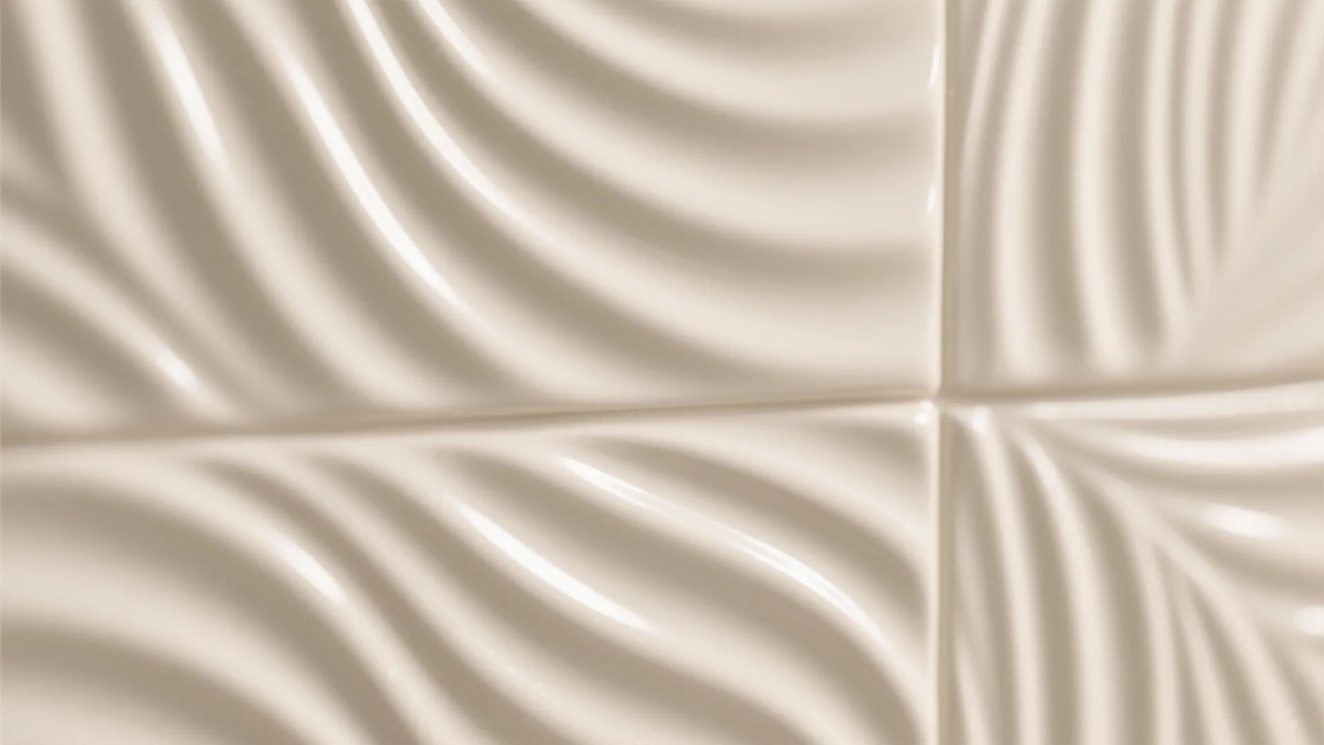 Close up view of beige wall tiles featuring a modern three dimensional wavy ribbed pattern