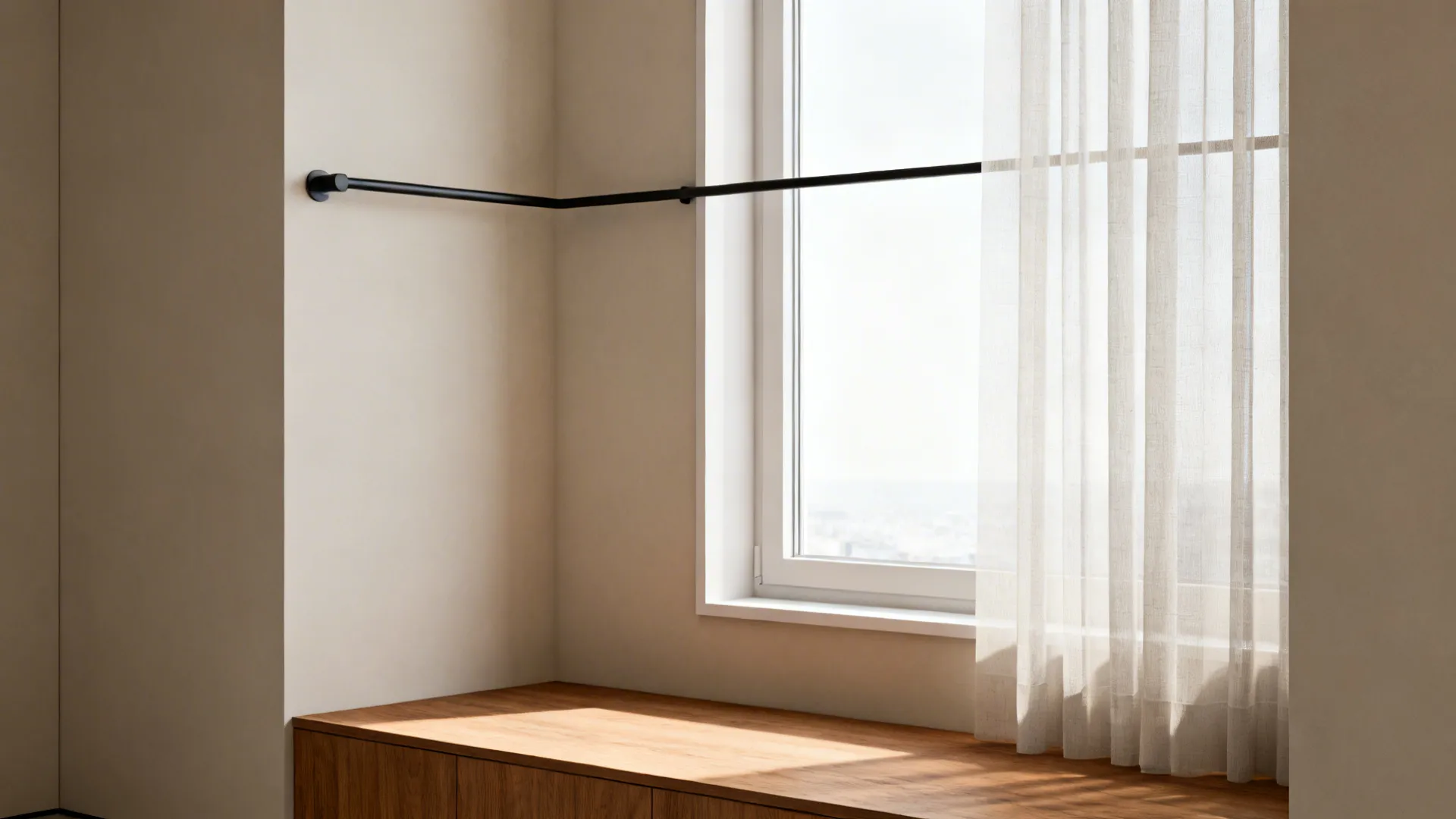 1. Slim matte black rod hung high to make ceilings feel taller