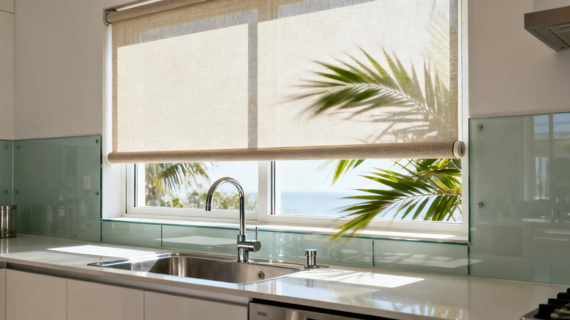Kitchen sink with matte PVC roller blind partially lowered to reduce glare.