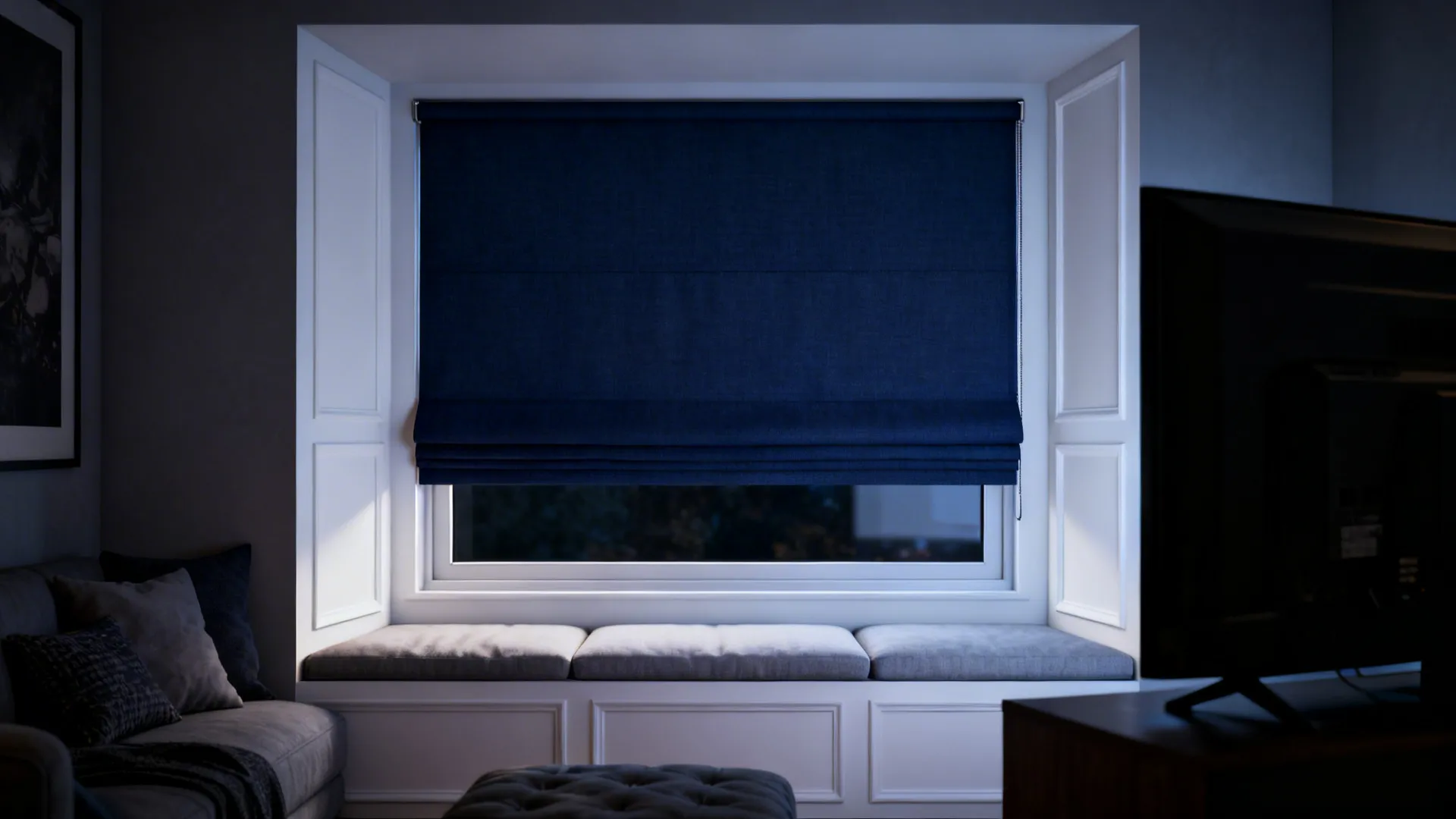 Cozy TV nook with navy blackout roman shade and white side panels