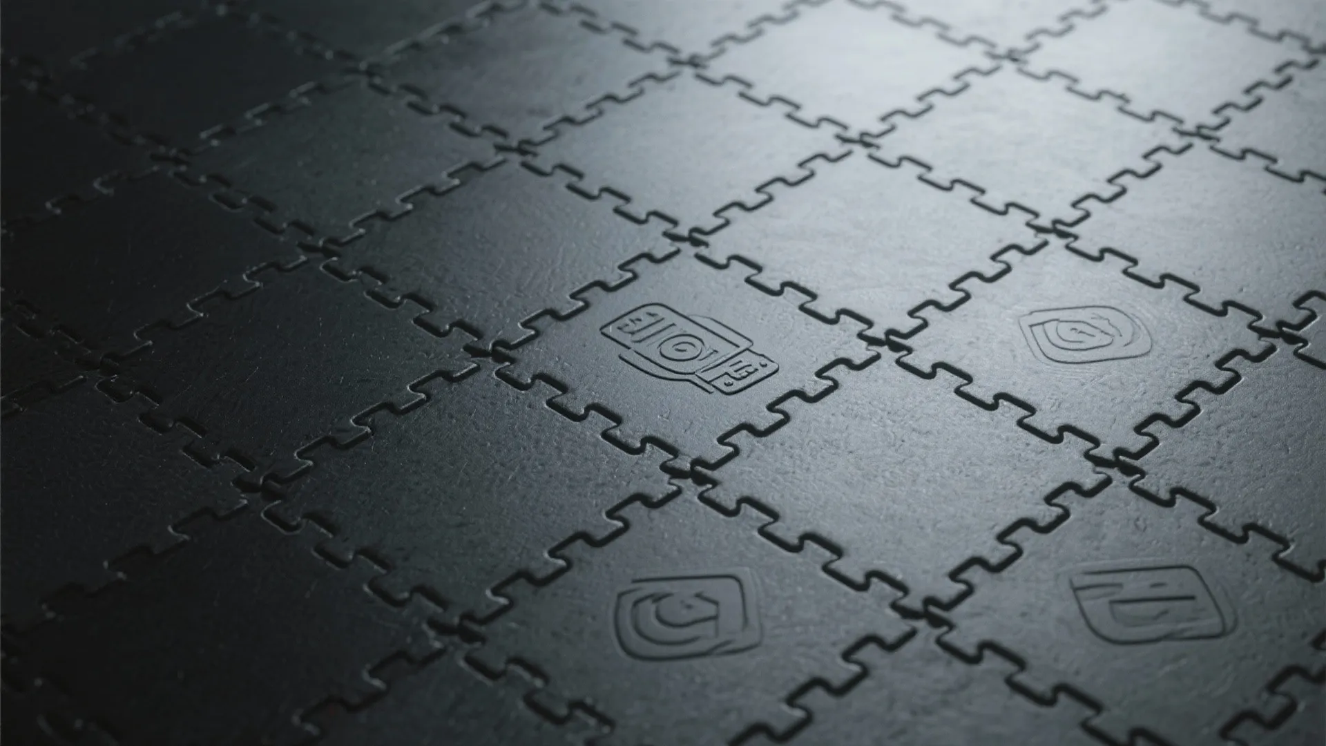 Close up of black interlocking rubber floor tiles used for protecting ground in a home gym