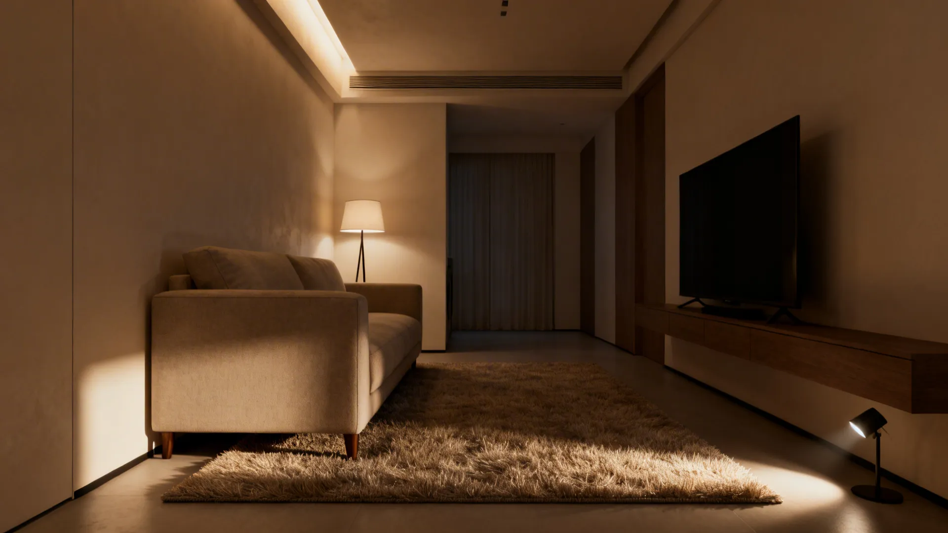 Rug anchoring the seating area with layered lighting creating cozy zones in a small living room.