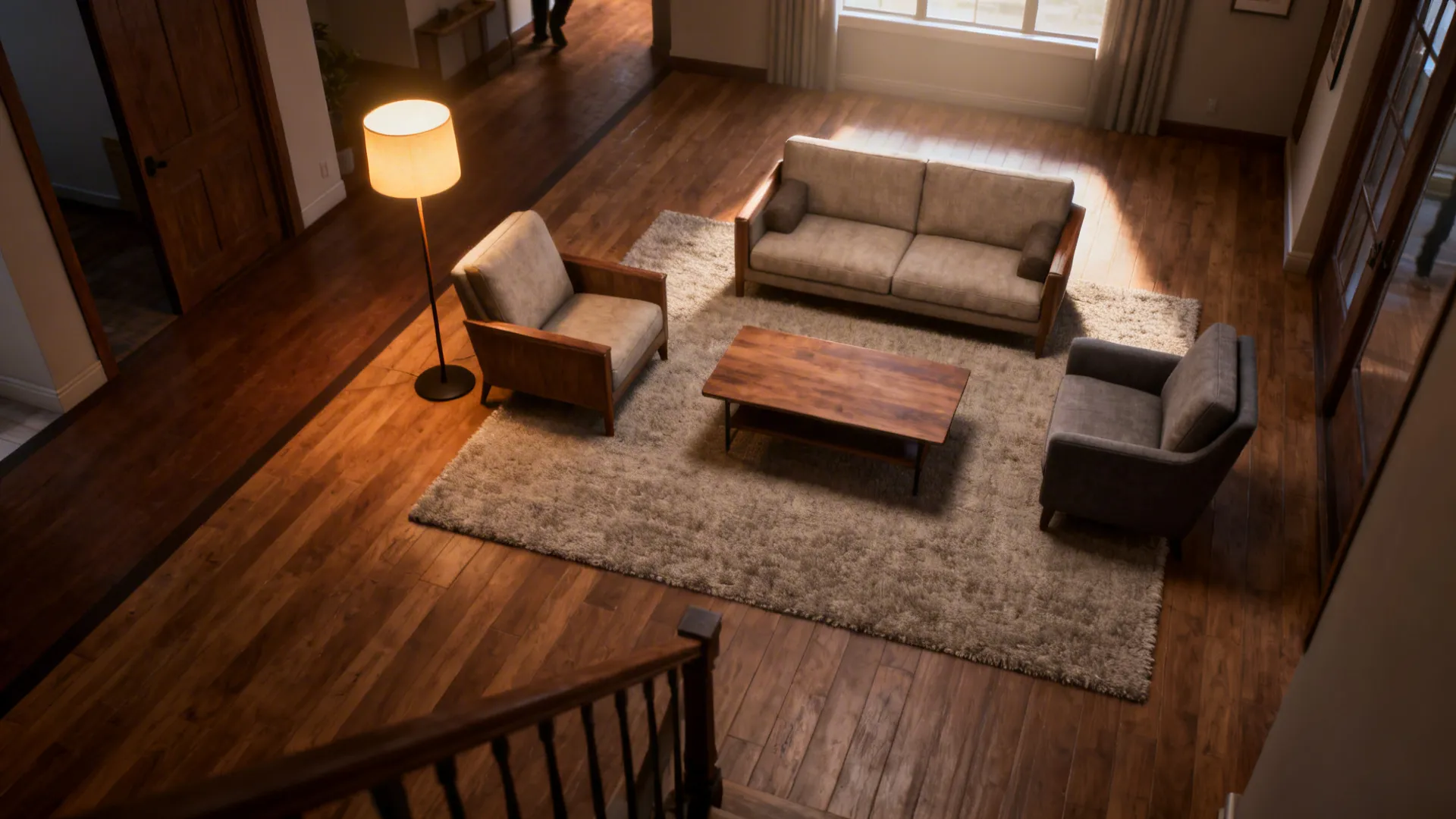 Small living room with rug and layered lighting defining the seating zone and traffic flow