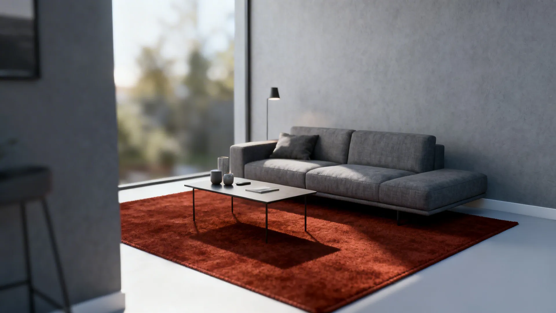 Modern small living room with a solid rust rug and mid-gray sofa creating warm-cool contrast.