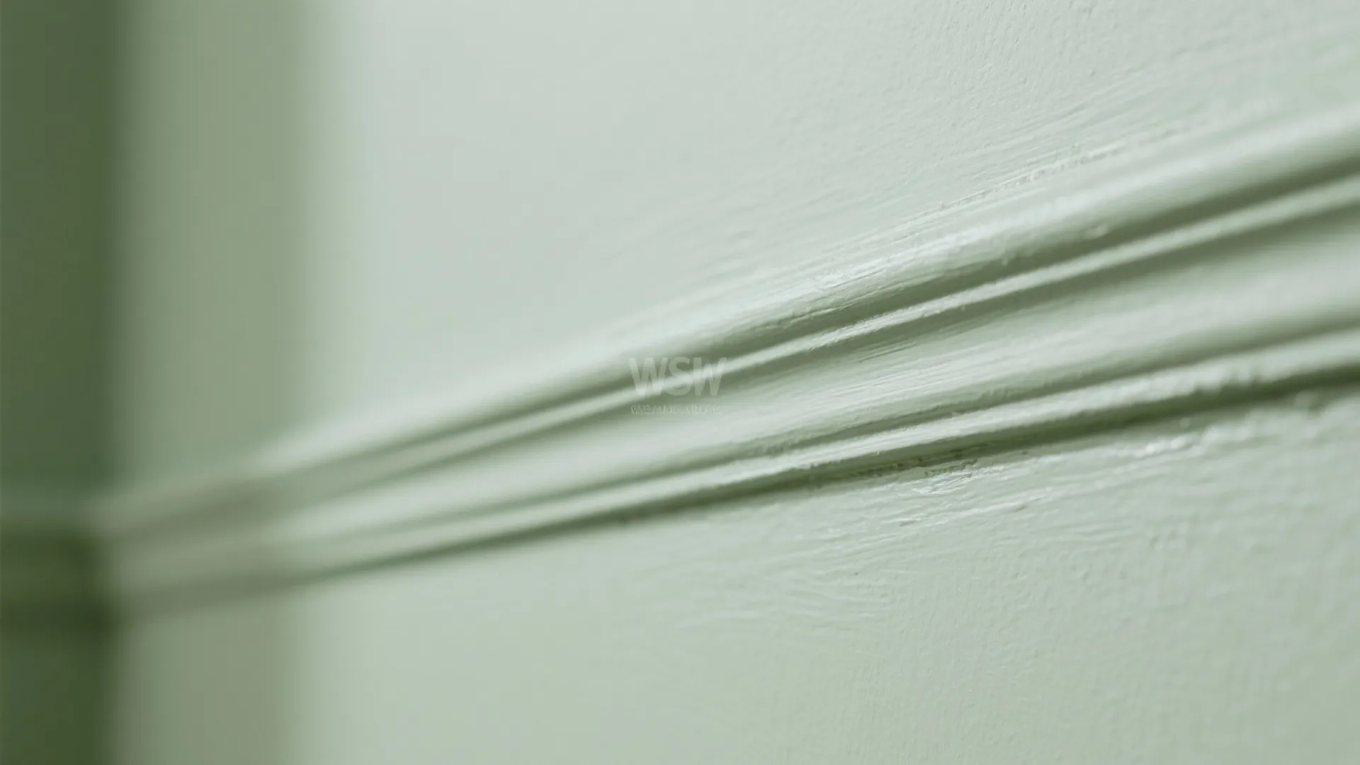 Macro of sage wall and slightly lighter sage trim showing subtle sheen difference.