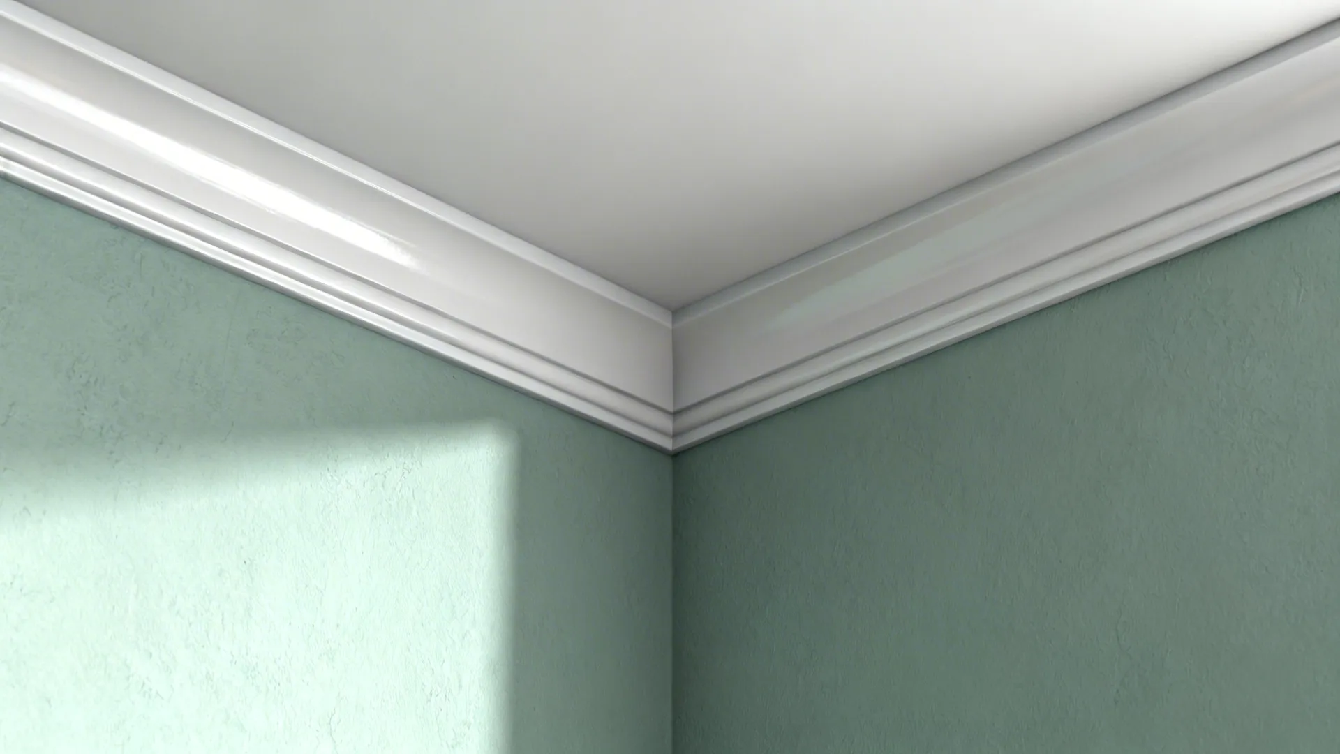 Close-up of soft sage wall with crisp white trim and visible paint texture.