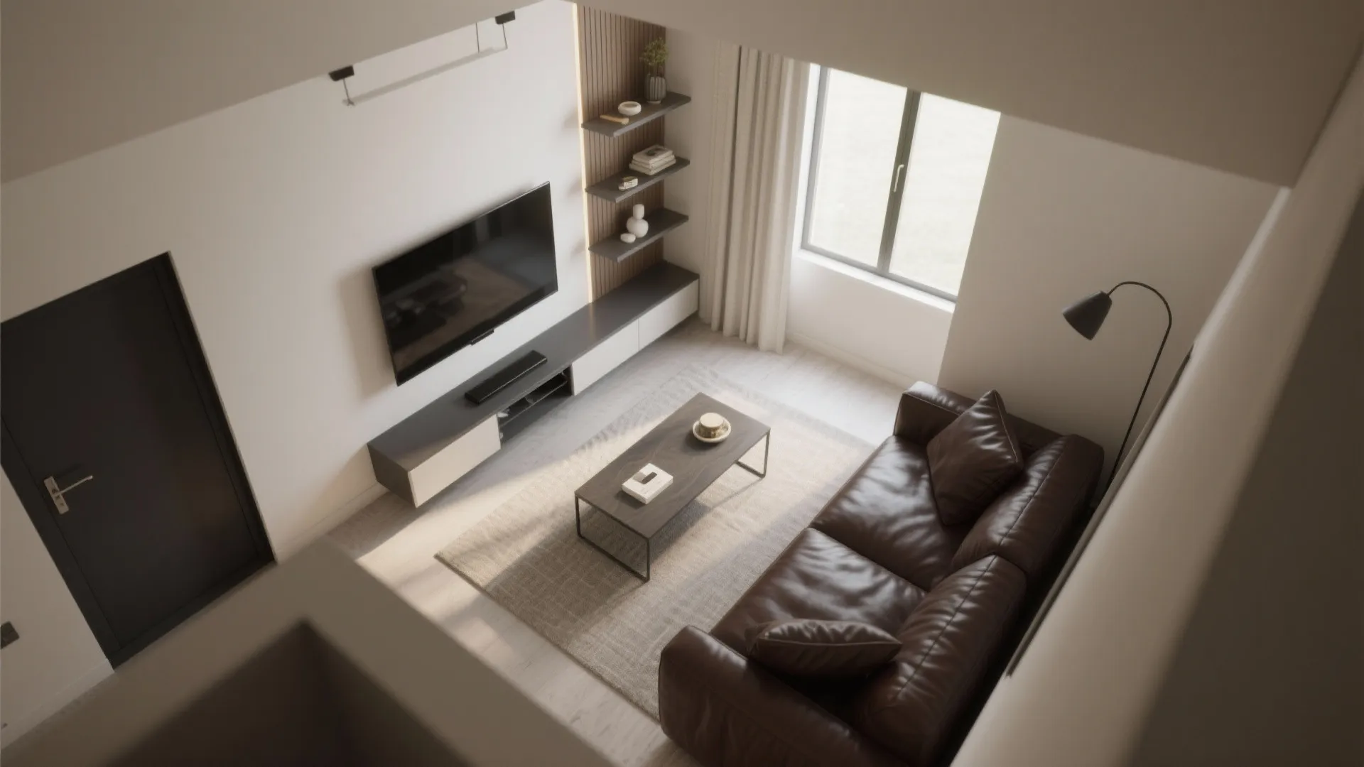 Top-down view of a small living room layout with a dark leather couch and scaled furniture