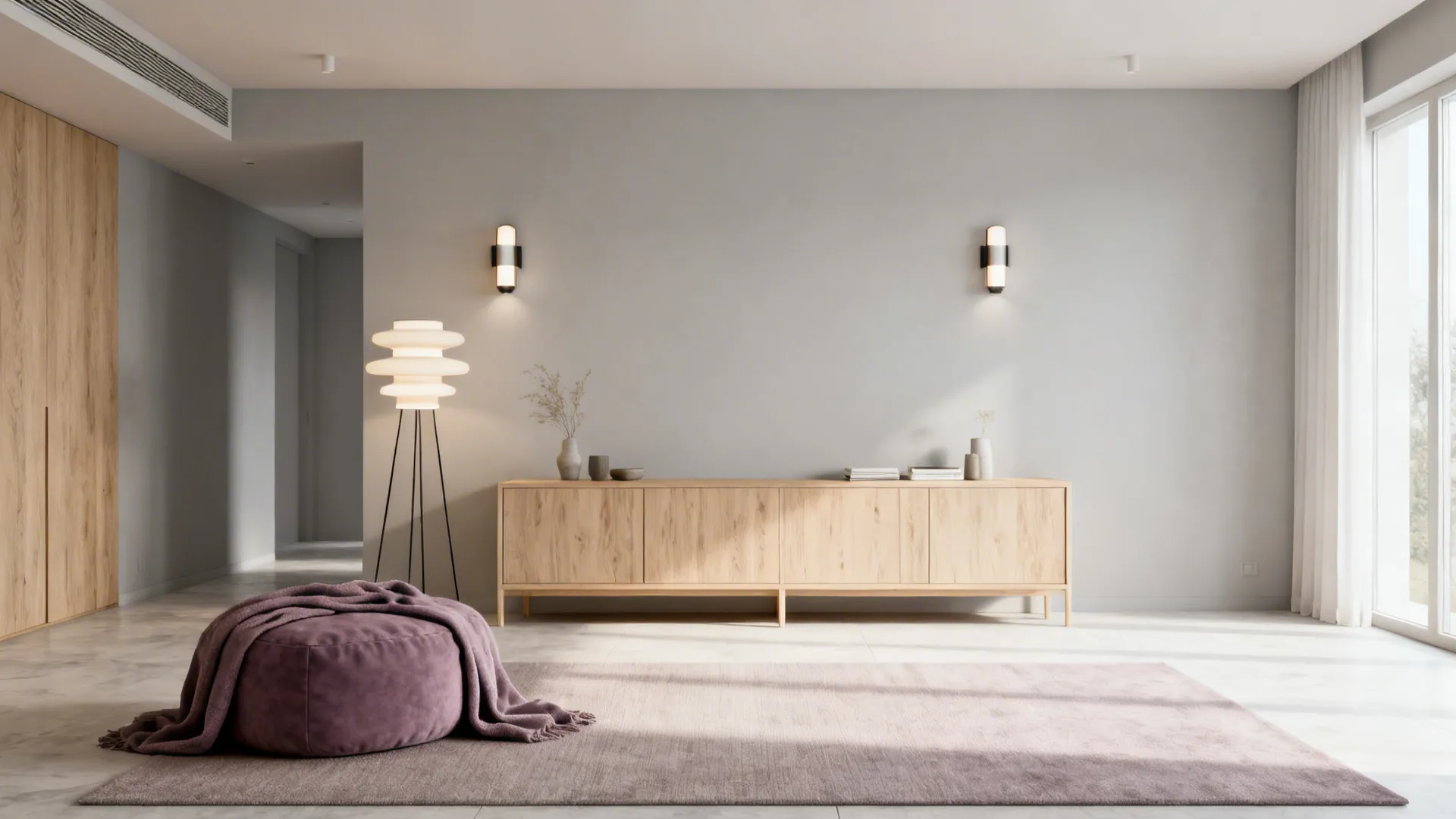 Scandinavian living room with pale grey walls, light wood furniture and dusty purple accents.