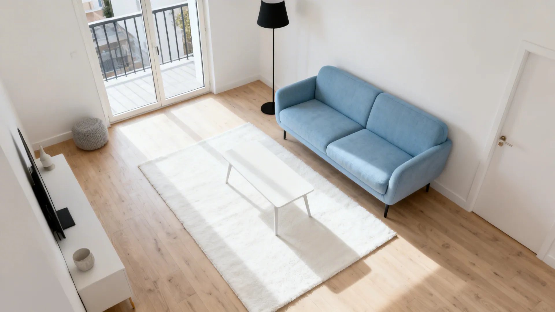 Top-down view of a Scandi layout with a sky-blue loveseat and clear circulation routes.